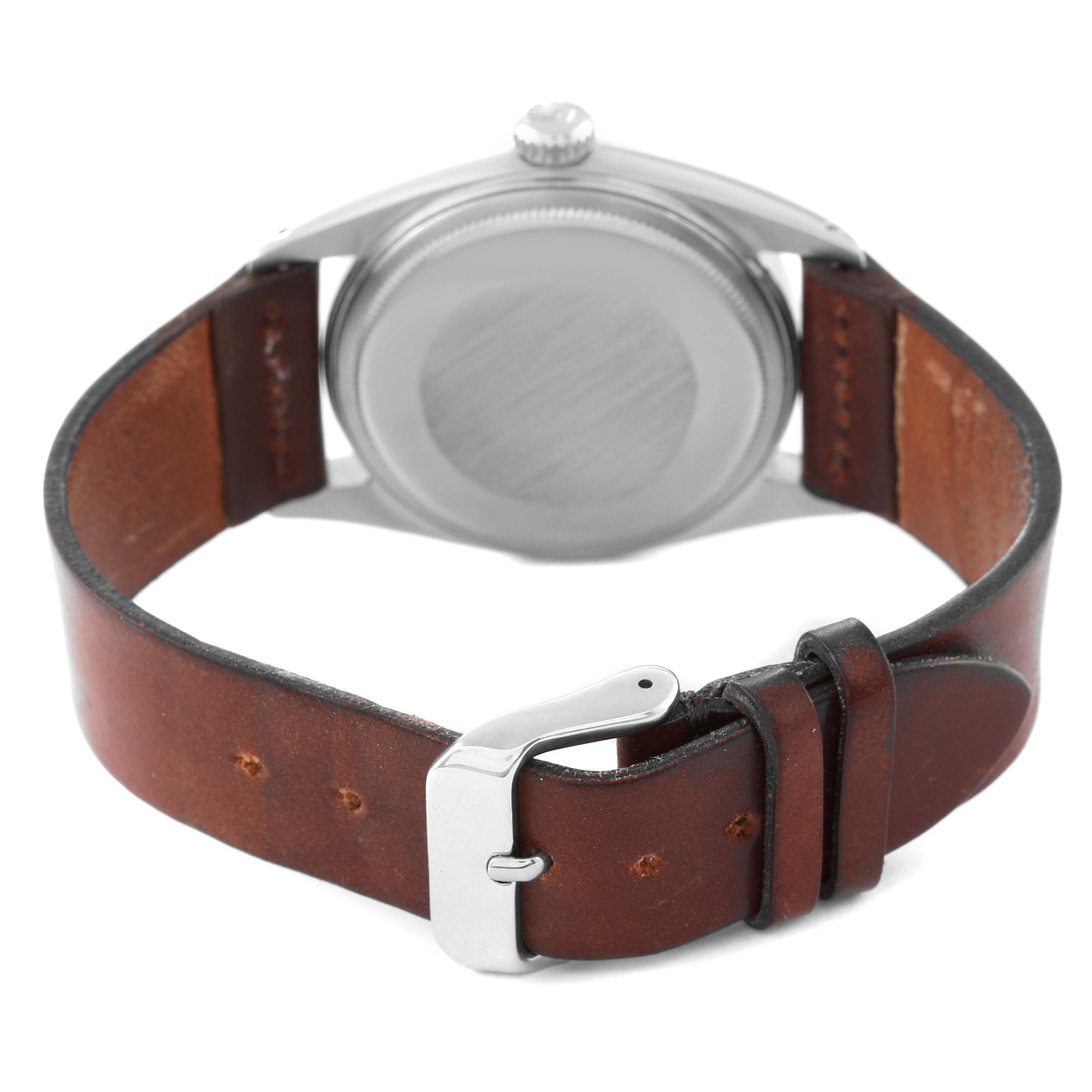 The image shows the back side of a Vintage Collection Rolex watch, highlighting the case back, crown, and leather strap with buckle.