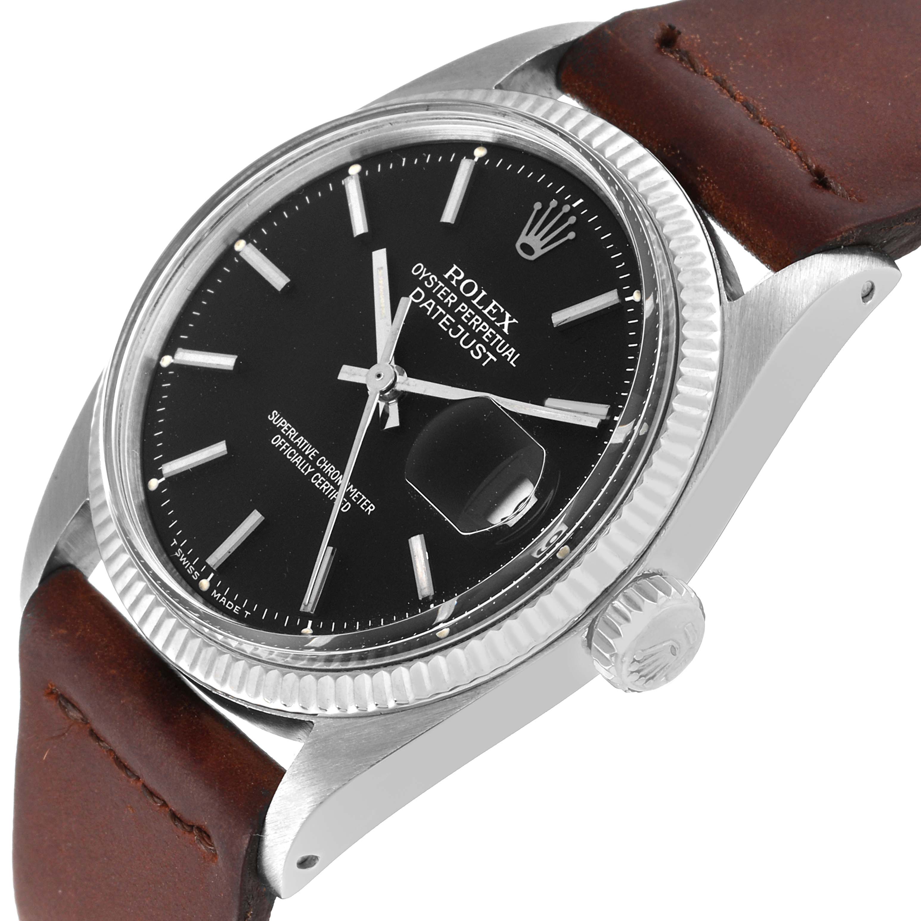 The Rolex Vintage Collection 1601 Men's Stainless Steel Black Dial 1601 Men's Stainless Steel Black Dial Datejust watch is shown at an oblique angle, highlighting its black dial, stainless steel case, and brown leather strap.