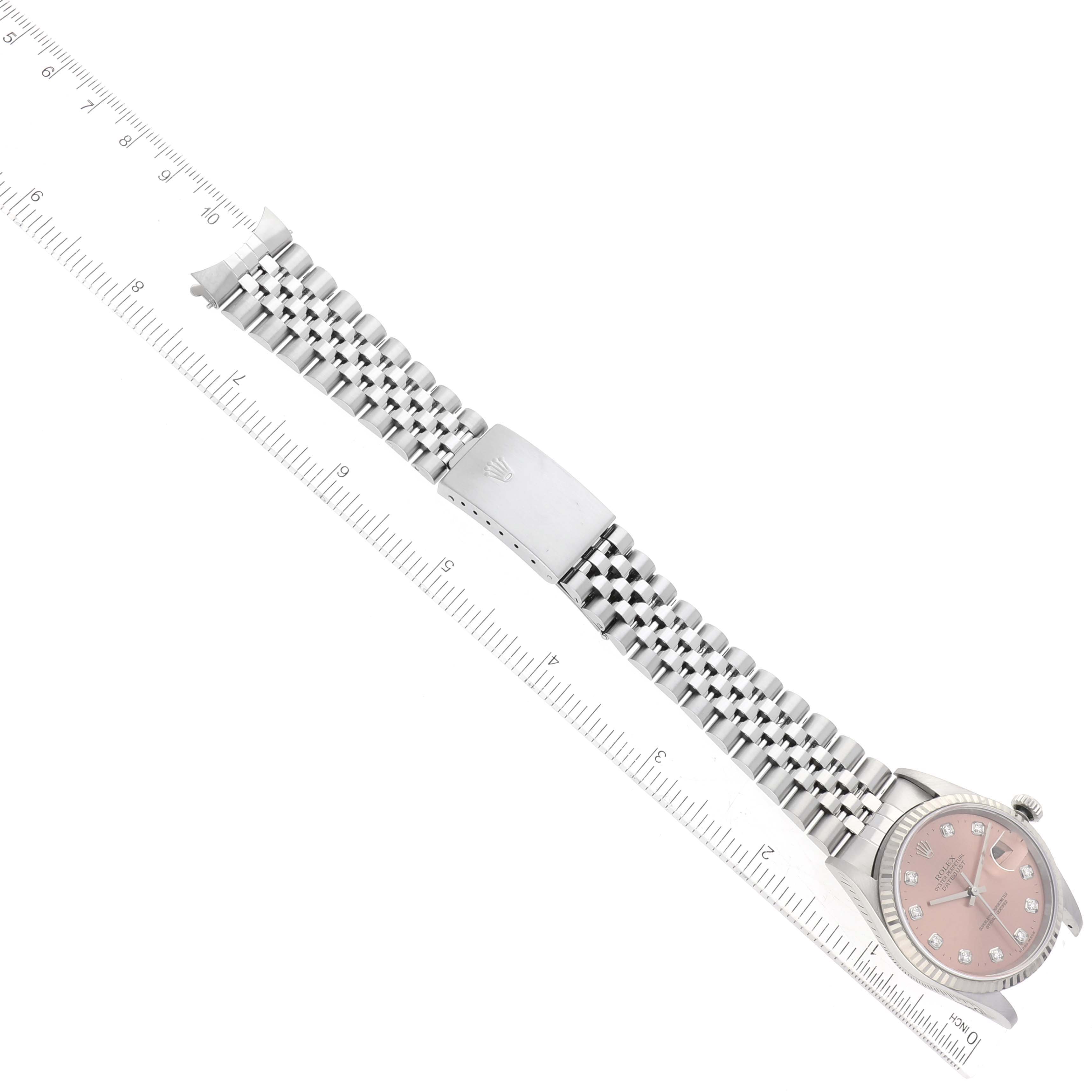 This image shows a top view of a Rolex Datejust 16234 Men's Stainless Steel Pink Dial 16234 Men's Stainless Steel Pink Dial watch, including the dial, case, and bracelet with a clasp.