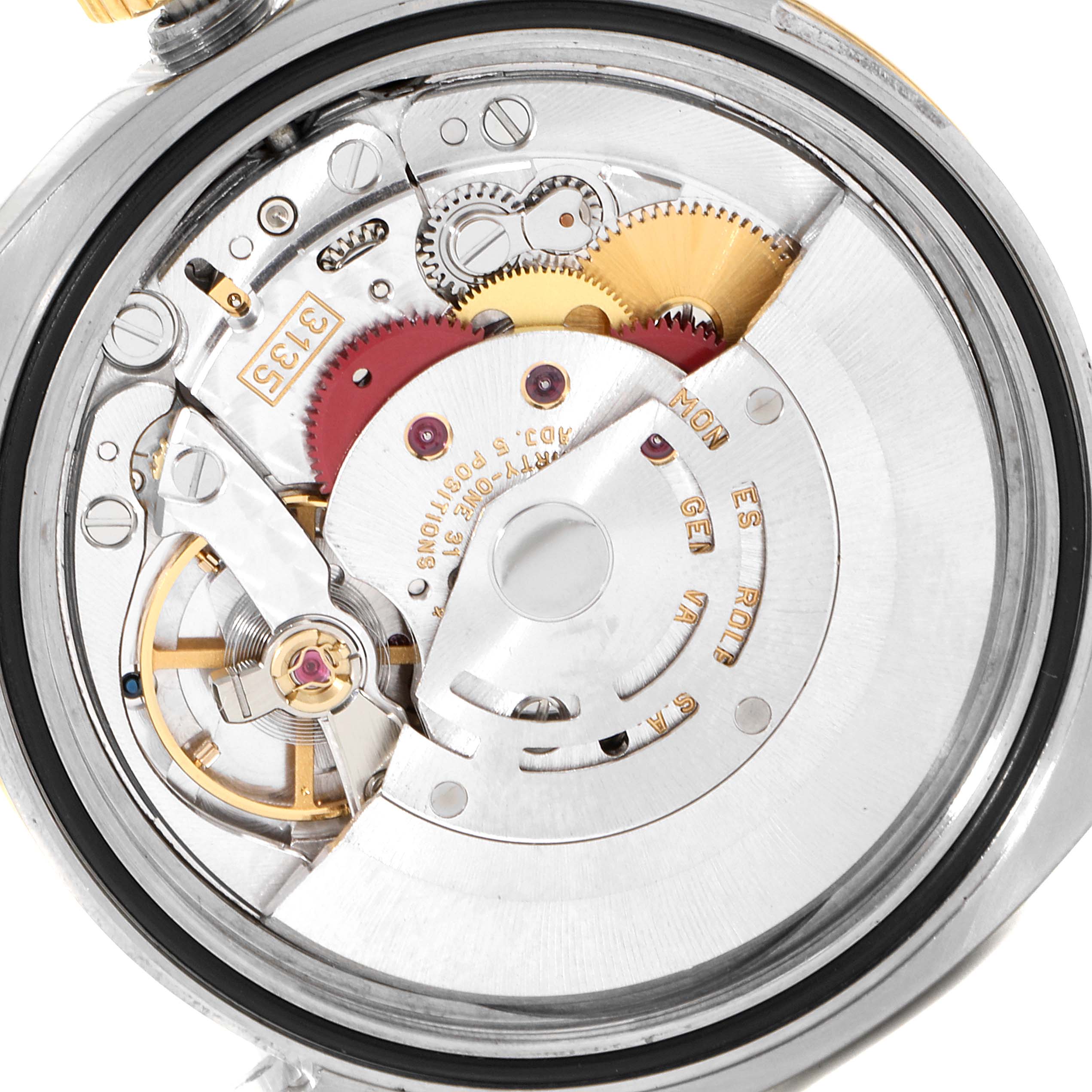 This image shows the internal mechanism of a Rolex Datejust 116233 Men's Steel and Gold (two tone) Black Dial 116233 Men's Steel and Gold (two tone) Black Dial watch, including its gears and rotor.