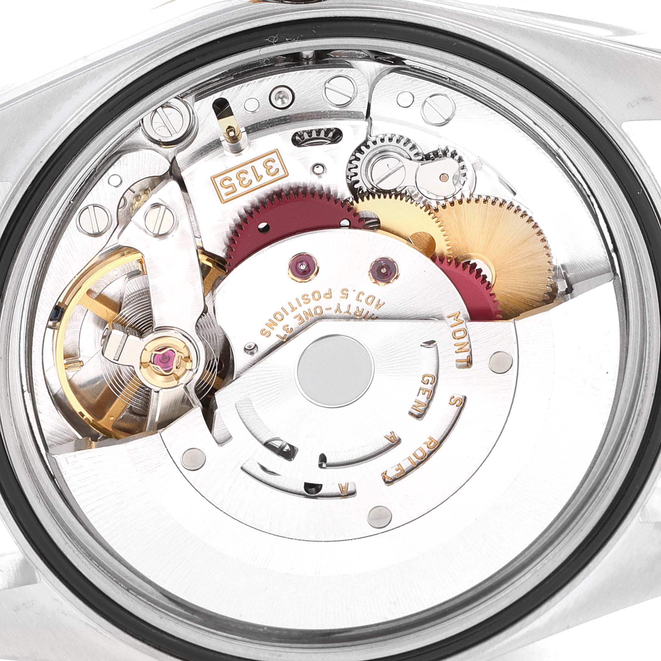 This image shows the inner mechanical movement of the Rolex Datejust 16233 Men's Steel and Gold (two tone) Black Dial 16233 Men's Steel and Gold (two tone) Black Dial watch, specifically the rotor, gears, and other intricate components.