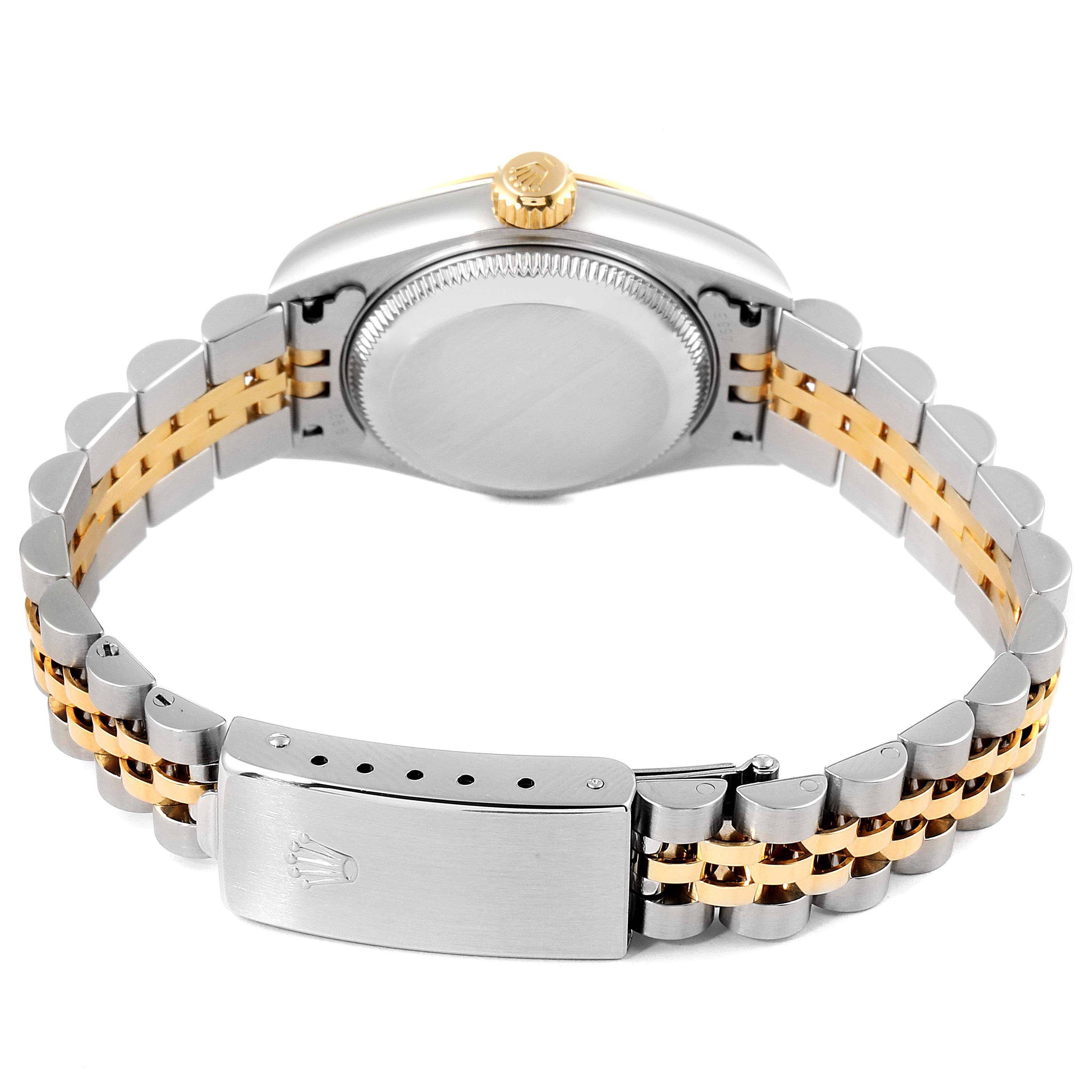 This is a rear view of a Rolex Datejust 79173 Women's Steel and Gold (two tone) Champagne Dial 79173 Women's Steel and Gold (two tone) Champagne Dial watch showing the case back, crown, and two-tone Jubilee bracelet with a clasp.