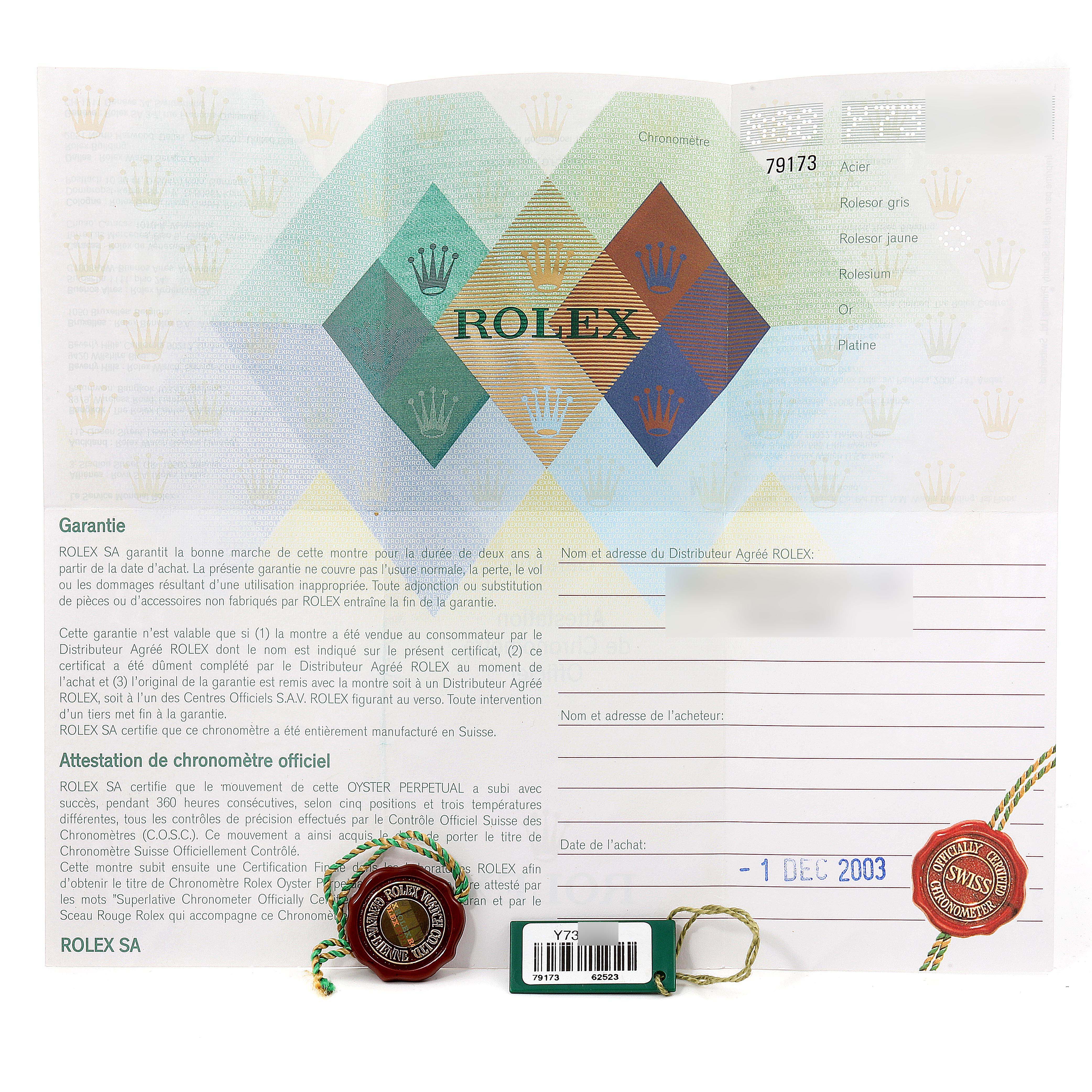 This image shows the warranty card, tags, and official seals for the Rolex Datejust 79173 Women's Steel and Gold (two tone) Champagne Dial 79173 Women's Steel and Gold (two tone) Champagne Dial model.