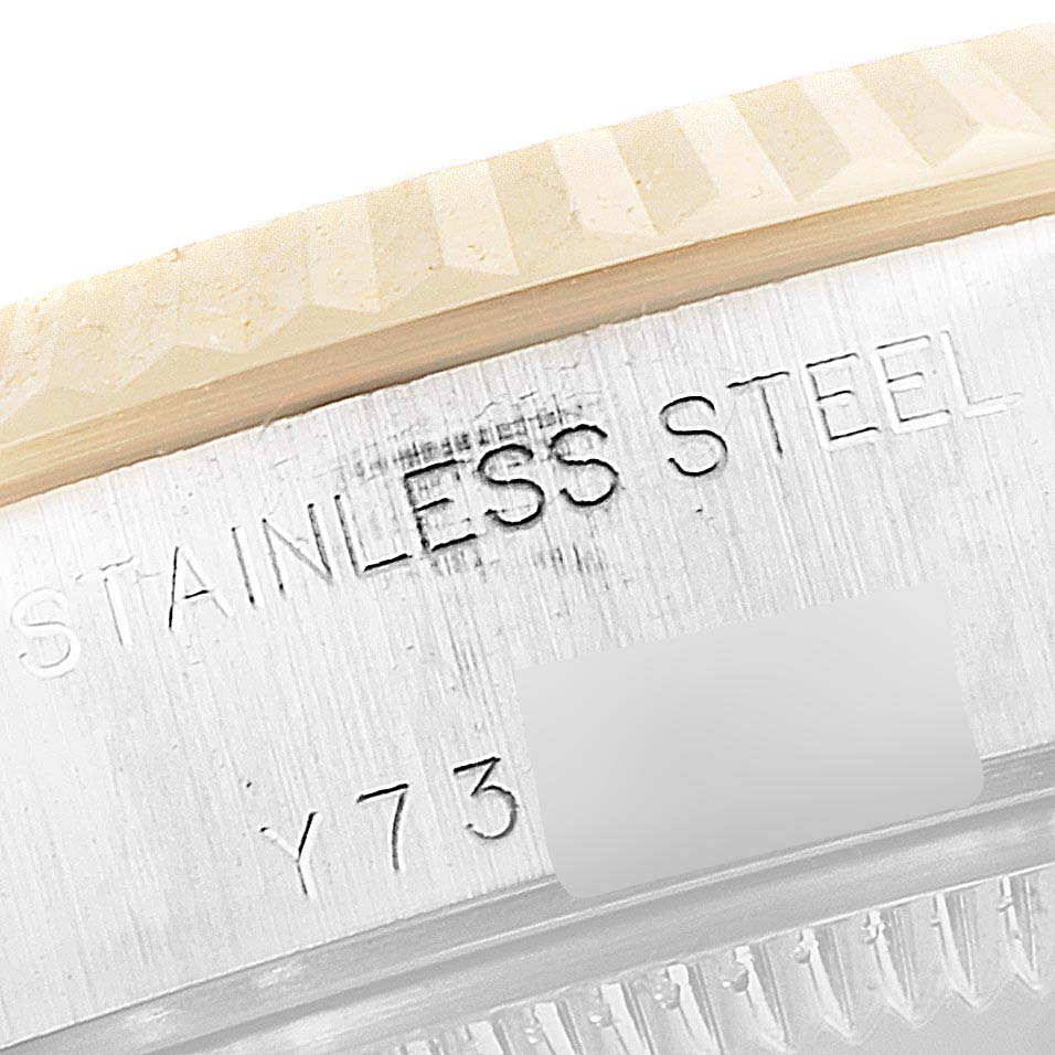This image shows a close-up of the inscription on the stainless steel casing of a Rolex Datejust 79173 Women's Steel and Gold (two tone) Champagne Dial 79173 Women's Steel and Gold (two tone) Champagne Dial watch.