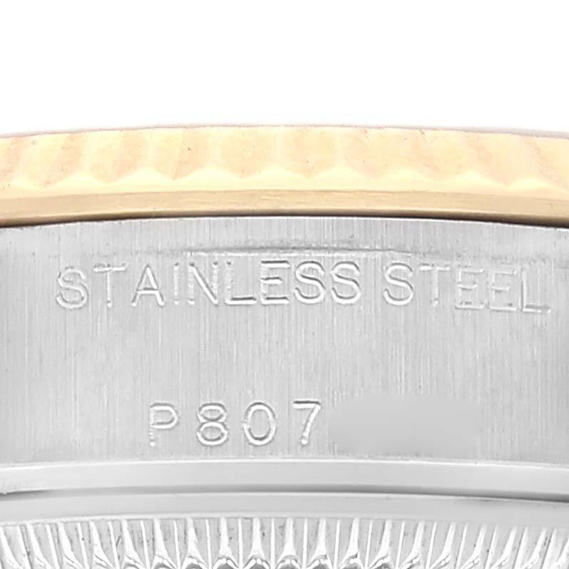 This image shows a close-up of the side engraving on a Rolex Datejust 79173 Women's Steel and Gold (two tone) Silver Dial 79173 Women's Steel and Gold (two tone) Silver Dial watch, highlighting the "STAINLESS STEEL" inscription.