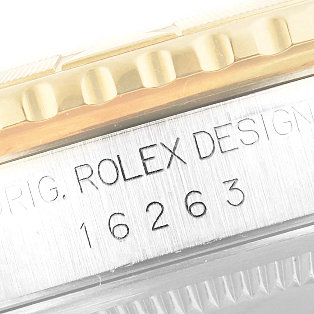 This image shows a close-up of the side of a Rolex Turn-o-Graph 16263 Men's Steel and Gold (two tone) Champagne Dial 16263 Men's Steel and Gold (two tone) Champagne Dial watch case, displaying the engraving "Rolex Design 16263".