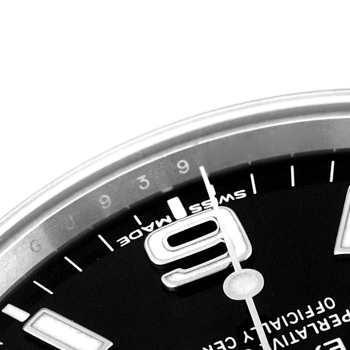 The image shows a close-up of the dial of a Rolex Explorer 214270 Men's Stainless Steel Black Dial 214270 Men's Stainless Steel Black Dial watch, focusing on the 9 o'clock numeral and surrounding markers.