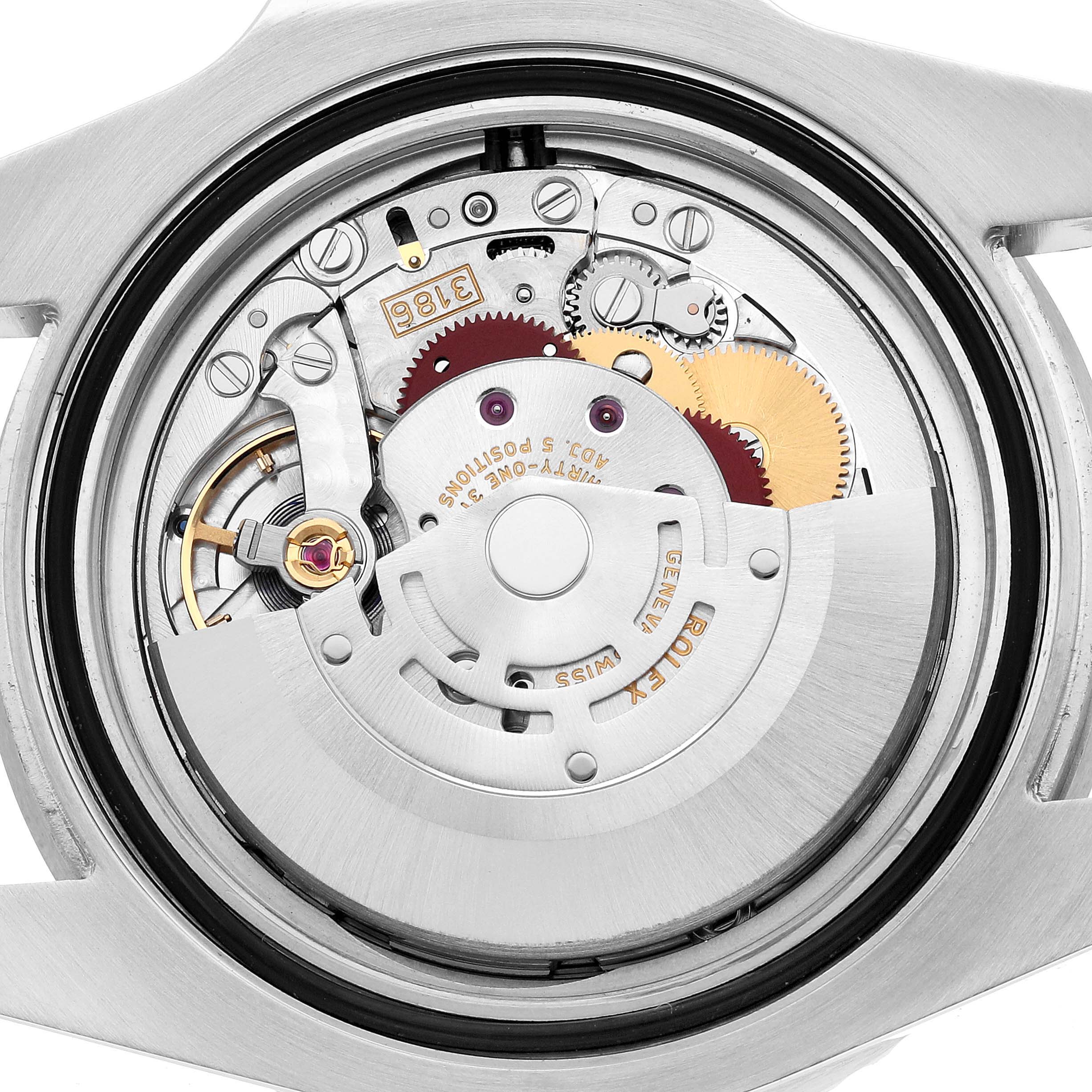 The image shows the open case back of a Rolex GMT-Master 126710BLNR Men's Stainless Steel Black Dial, revealing its intricate movement and components.