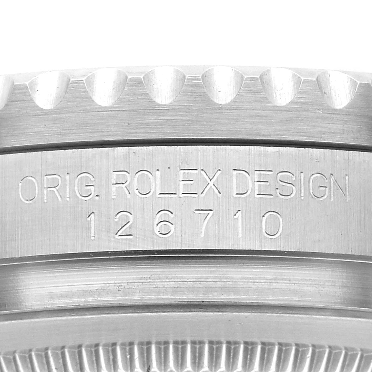 This image shows a close-up of the case side of a Rolex GMT-Master 126710 Men's Stainless Steel Black Dial 126710 Men's Stainless Steel Black Dial watch, focusing on the engraved model number "126710".