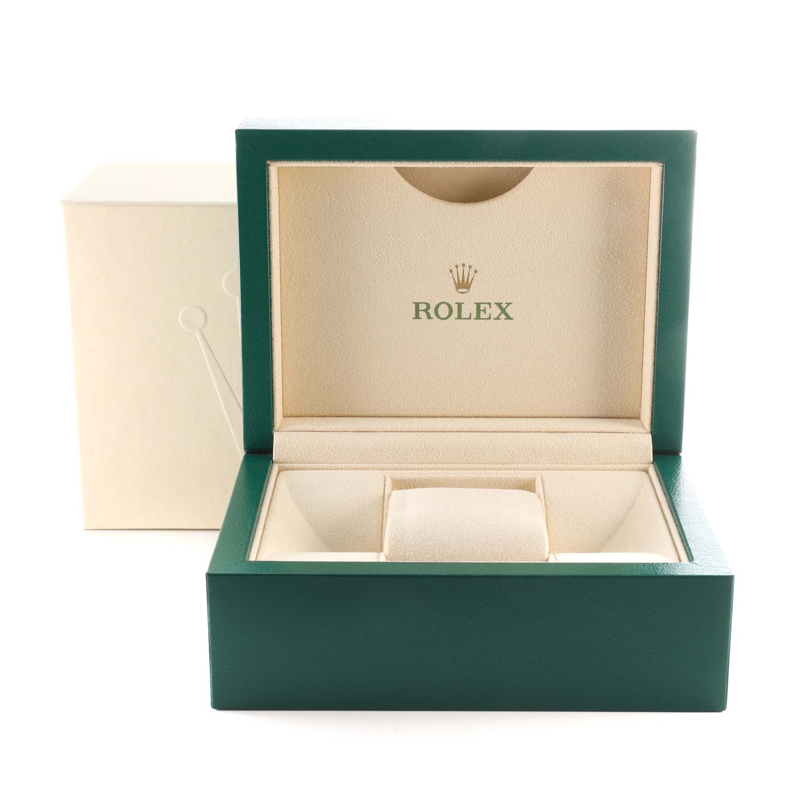 The image shows an open Rolex watch box in a beige and green color scheme with a pillow for the Mid-Size model watch.