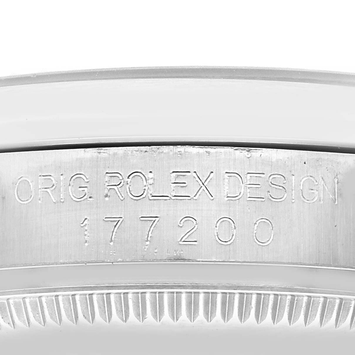 The image shows a close-up of the side of a Rolex Mid-Size 177200 Women's Stainless Steel Black Dial 177200 Women's Stainless Steel Black Dial model watch, focusing on the engraved design and model number "177200".