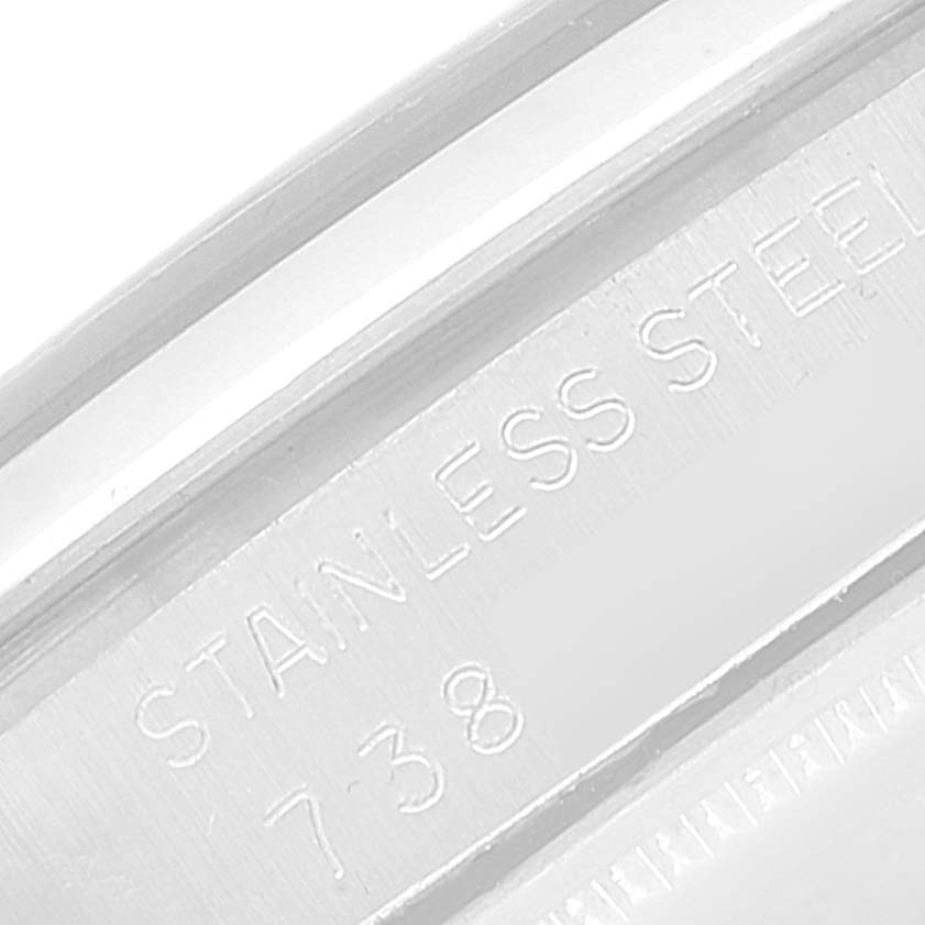 This image shows a close-up angle of the stainless steel casing on a Rolex Vintage Collection 6426 Men
s Stainless Steel Silver Dial 6426 Men
s Stainless Steel Silver Dial watch, featuring engraved text.