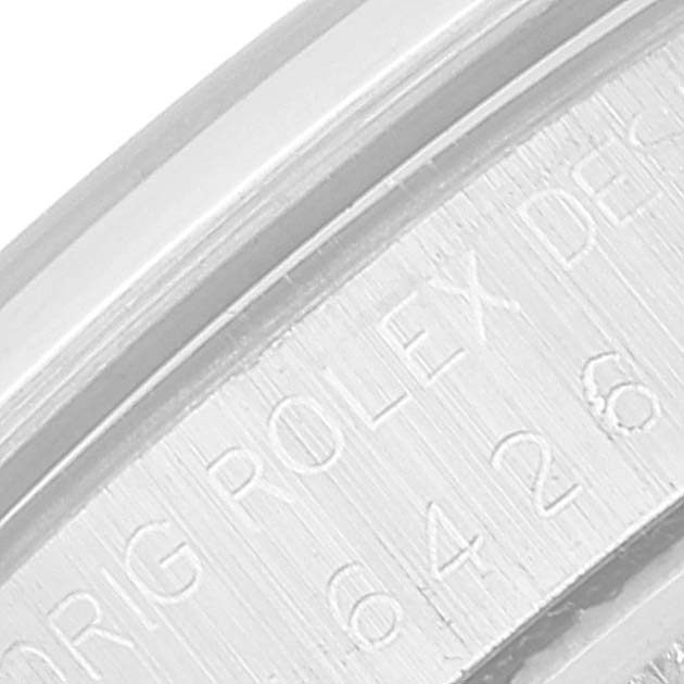 This close-up of the Vintage Collection Rolex watch shows part of the engraved inner rim and the serial number.