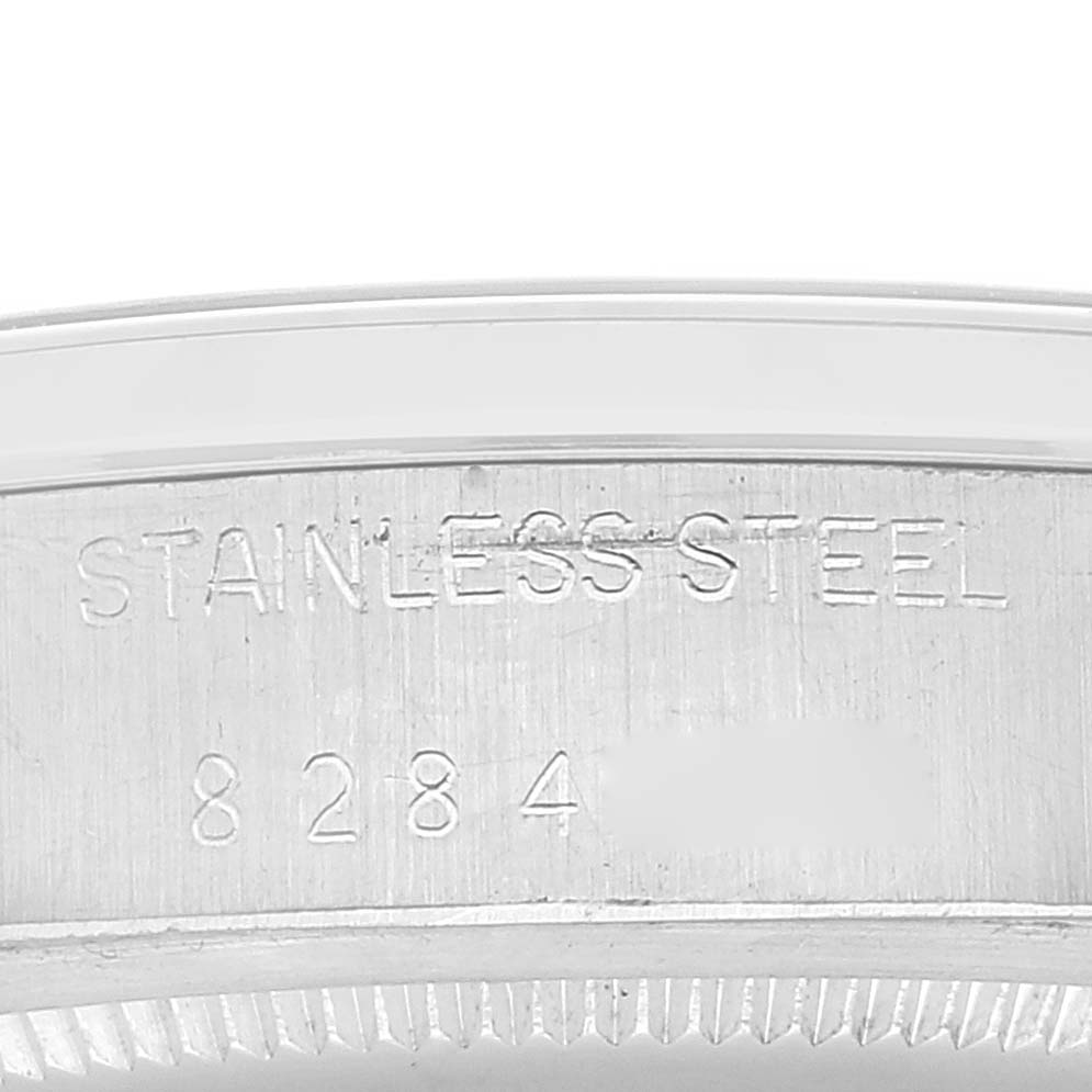 This image shows a close-up of the stainless steel case back edge with serial number engraving of a Rolex Vintage Collection 6694 Men
s Stainless Steel Silver Dial 6694 Men
s Stainless Steel Silver Dial watch.