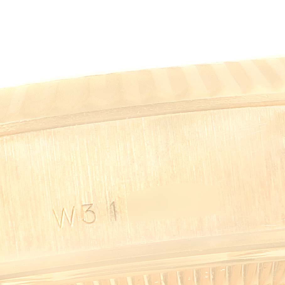 This image shows a close-up of the serial number engraving on the case back of a Rolex President 69178 Women's Yellow Gold Champagne Dial 69178 Women's Yellow Gold Champagne Dial model watch.