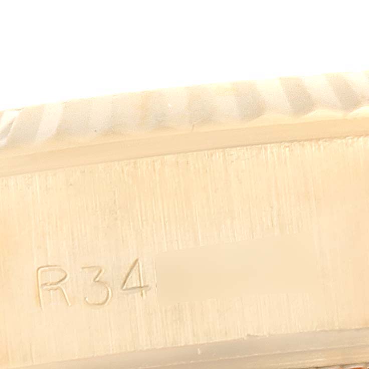 This image shows a close-up side view of the Rolex President 69178 Women's Yellow Gold White Dial 69178 Women's Yellow Gold White Dial model, highlighting the engraved details.