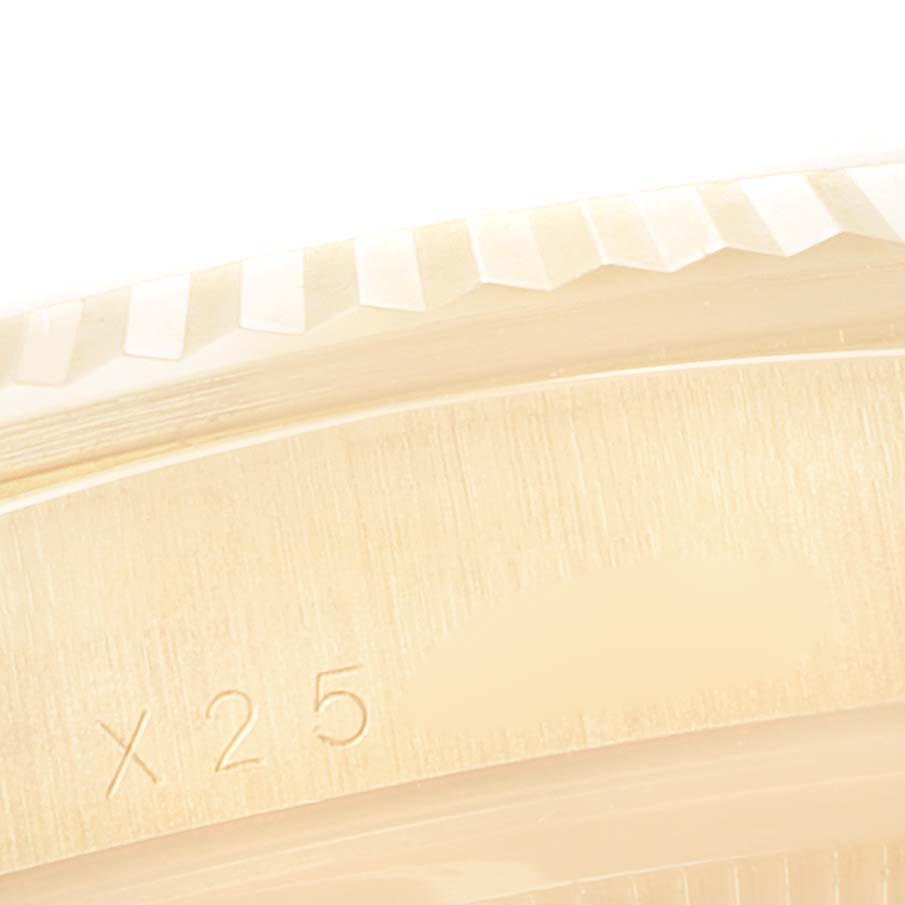 This close-up image shows part of the bezel and case of a Rolex President 18238 Men
s Yellow Gold Champagne Dial 18238 Men
s Yellow Gold Champagne Dial model watch.