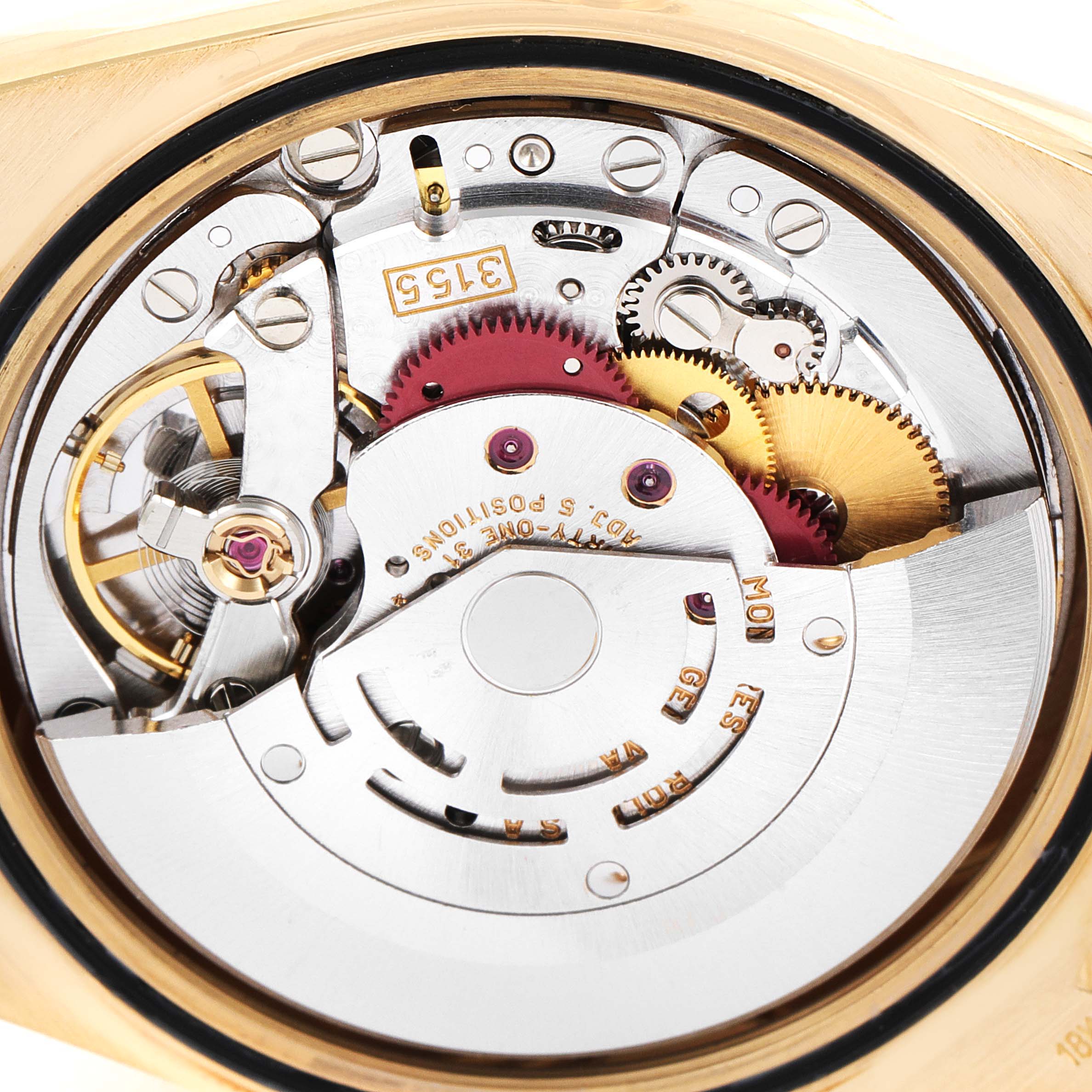 This image shows a close-up view of the intricate mechanism inside a Rolex President 18238 Men
s Yellow Gold Champagne Dial 18238 Men
s Yellow Gold Champagne Dial model watch.