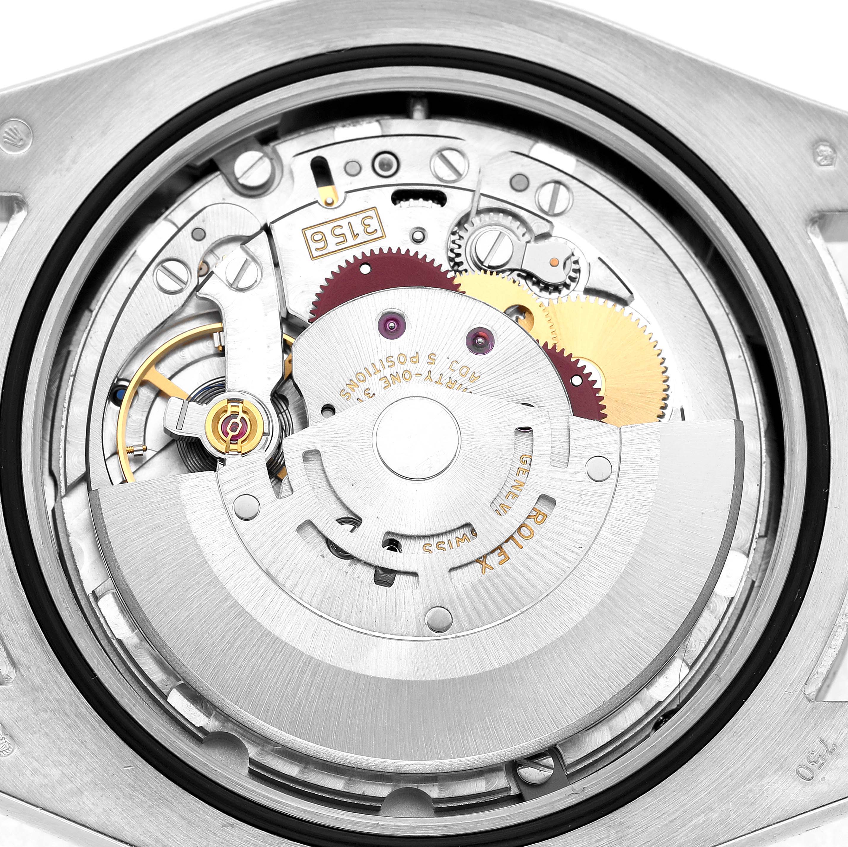 The image shows the movement mechanism of a Rolex President 218239 Men's White Gold Black Dial model watch from the back, highlighting gears and rotors.
