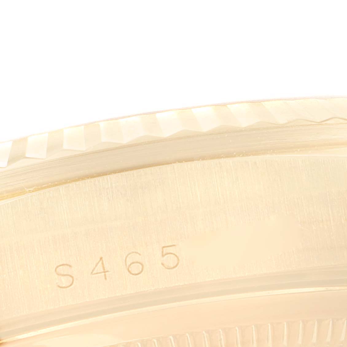 This close-up image shows the side engraving and fluted bezel of a Rolex President 18238 Men's Yellow Gold Champagne Dial 18238 Men's Yellow Gold Champagne Dial model watch.