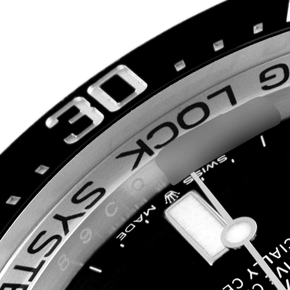 This close-up image of the Rolex Sea-Dweller 126660 Men
s Stainless Steel Black Dial 126660 Men
s Stainless Steel Black Dial watch shows the bezel, part of the dial, and the "Ring Lock System" text.