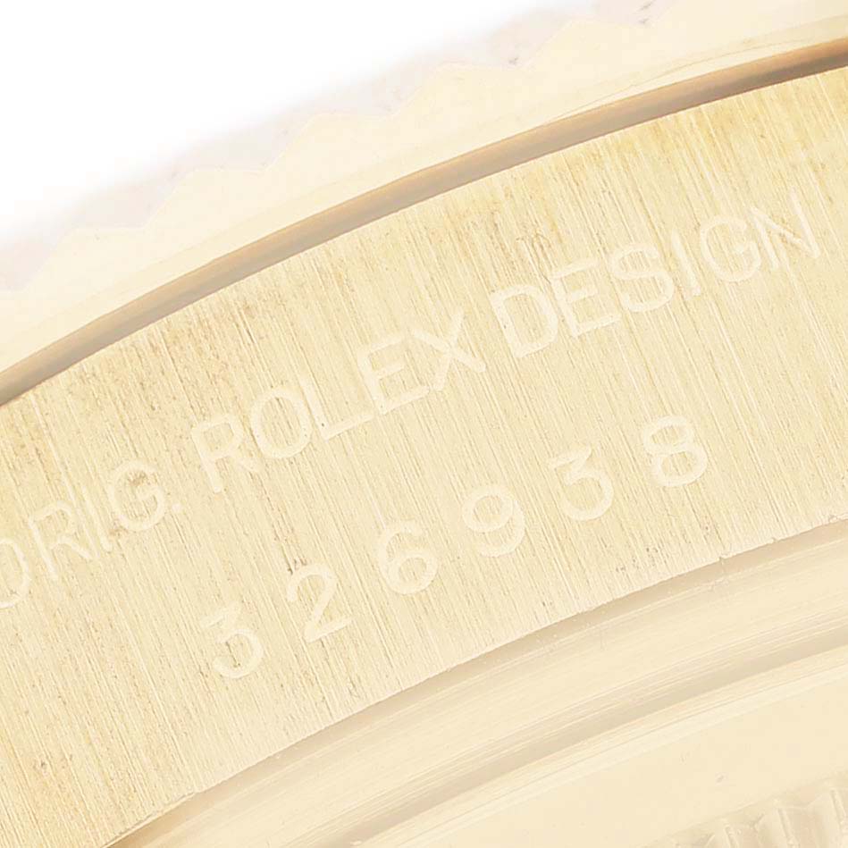 The image shows a close-up of the Rolex Sky-Dweller 326938 Men's Yellow Gold Champagne Dial's edge, highlighting serial numbers and the "ROLEX DESIGN" engraving.