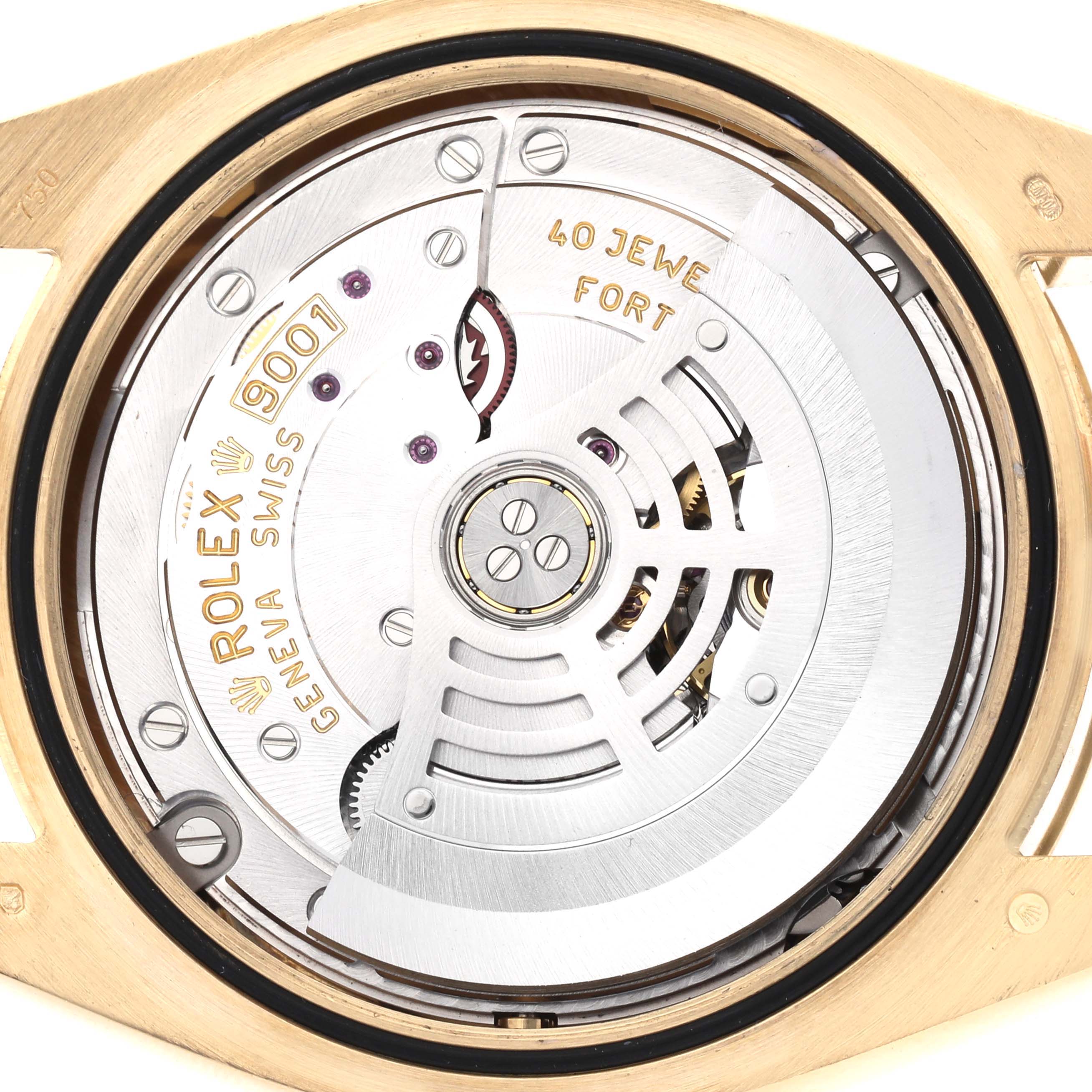 The image shows the movement of a Rolex Sky-Dweller 326938 Men's Yellow Gold Champagne Dial watch from a rear angle, highlighting its intricate mechanical components.