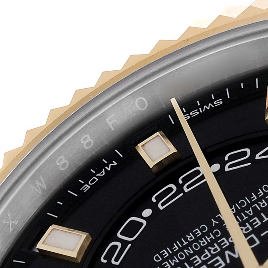 This close-up shows part of the dial and bezel of the Rolex Sky-Dweller 326933 Men
s Steel and Gold (two tone) Black Dial 326933 Men
s Steel and Gold (two tone) Black Dial watch, focusing on the hour markers and inner ring.
