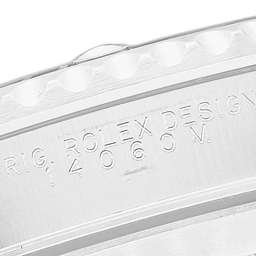 This image shows an engraved side view of the case back of a Rolex Submariner 14060M Men's Stainless Steel Black Dial 14060M Men's Stainless Steel Black Dial watch.