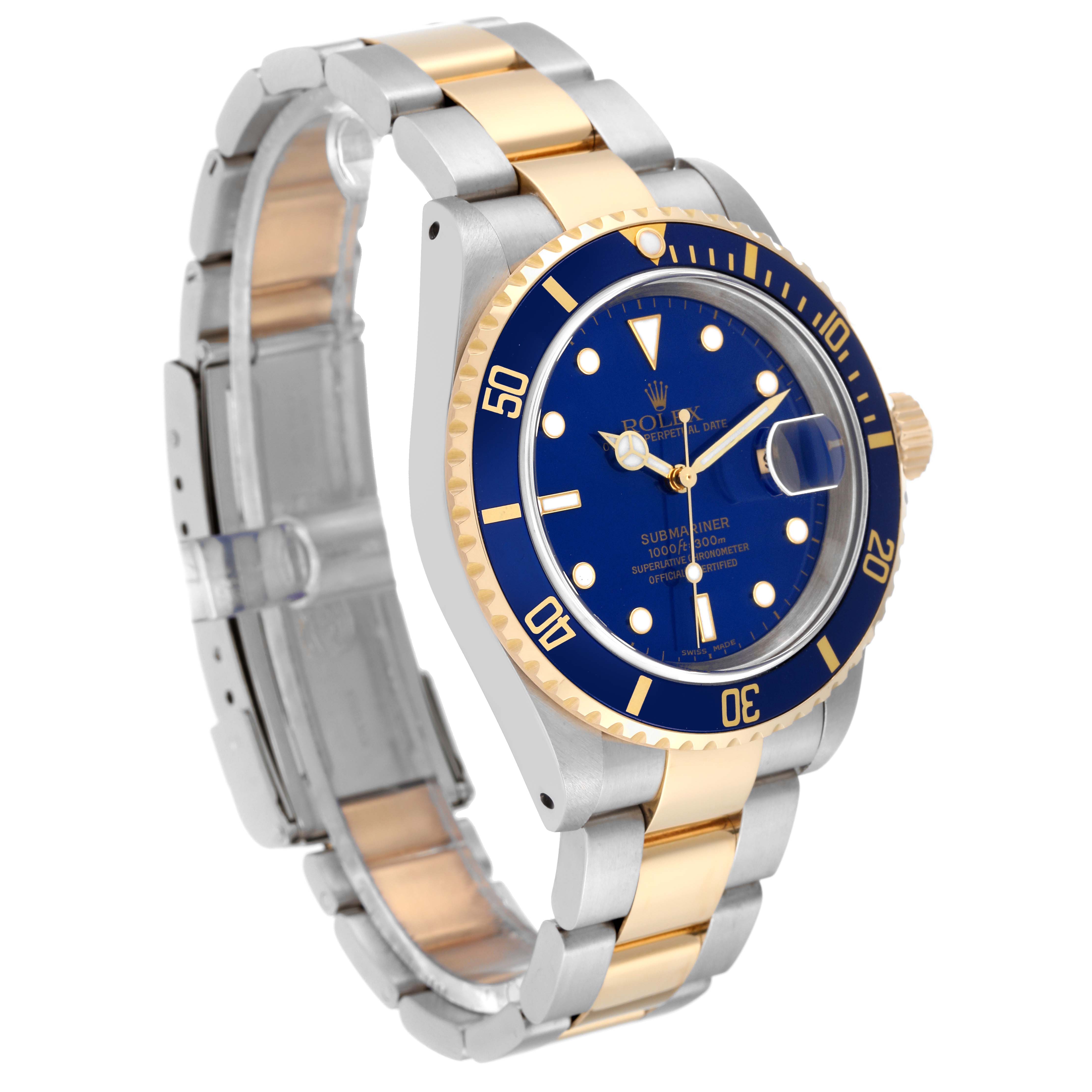 The Rolex Submariner 16613LB Men
s Steel and Gold (two tone) Blue Dial 16613LB Men
s Steel and Gold (two tone) Blue Dial watch is shown at a three-quarter angle, displaying its two-tone bracelet, blue dial, and rotating bezel.