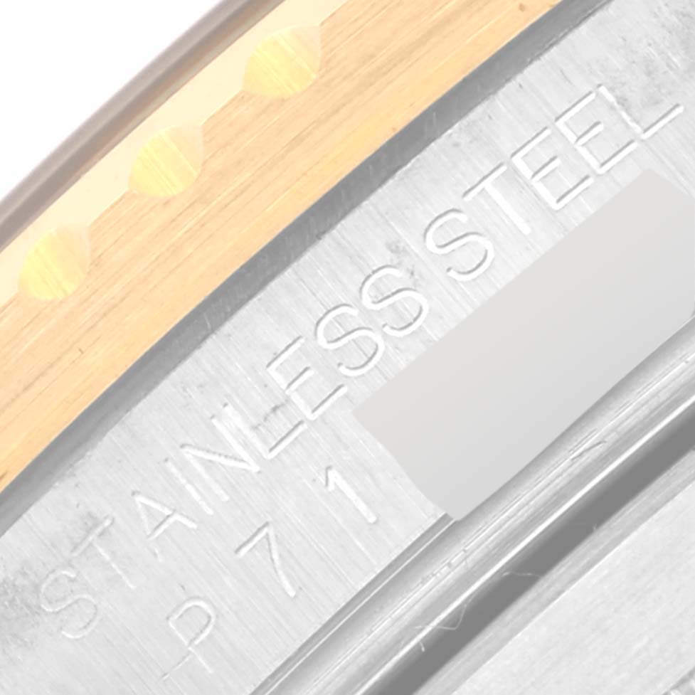 This is a close-up shot of the side engraving on the stainless steel case of a Rolex Submariner 16613LB Men
s Steel and Gold (two tone) Blue Dial 16613LB Men
s Steel and Gold (two tone) Blue Dial watch.