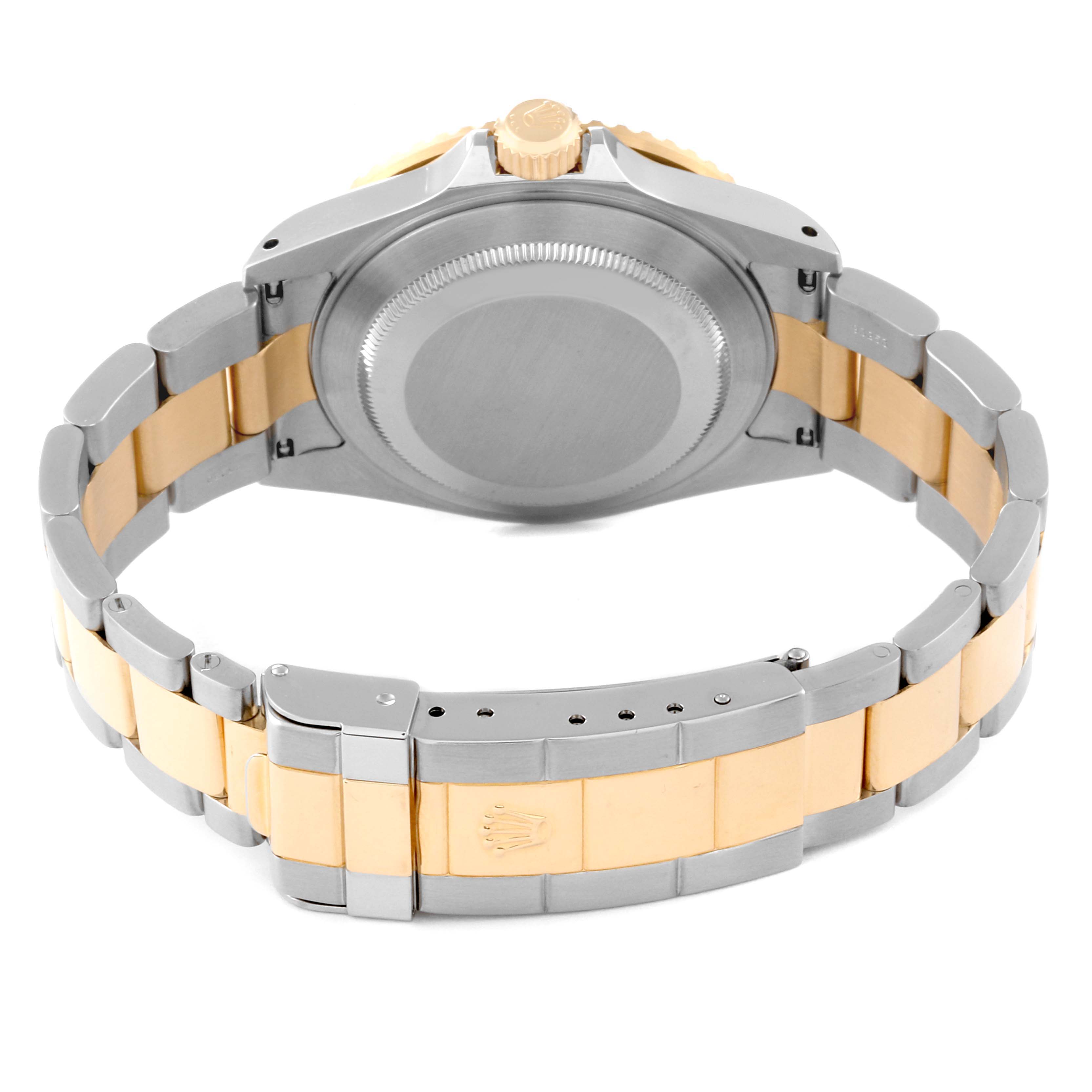 This image shows the back and bracelet of a Rolex Submariner 16613LB Men
s Steel and Gold (two tone) Blue Dial 16613LB Men
s Steel and Gold (two tone) Blue Dial watch, highlighting its two-tone metal design.