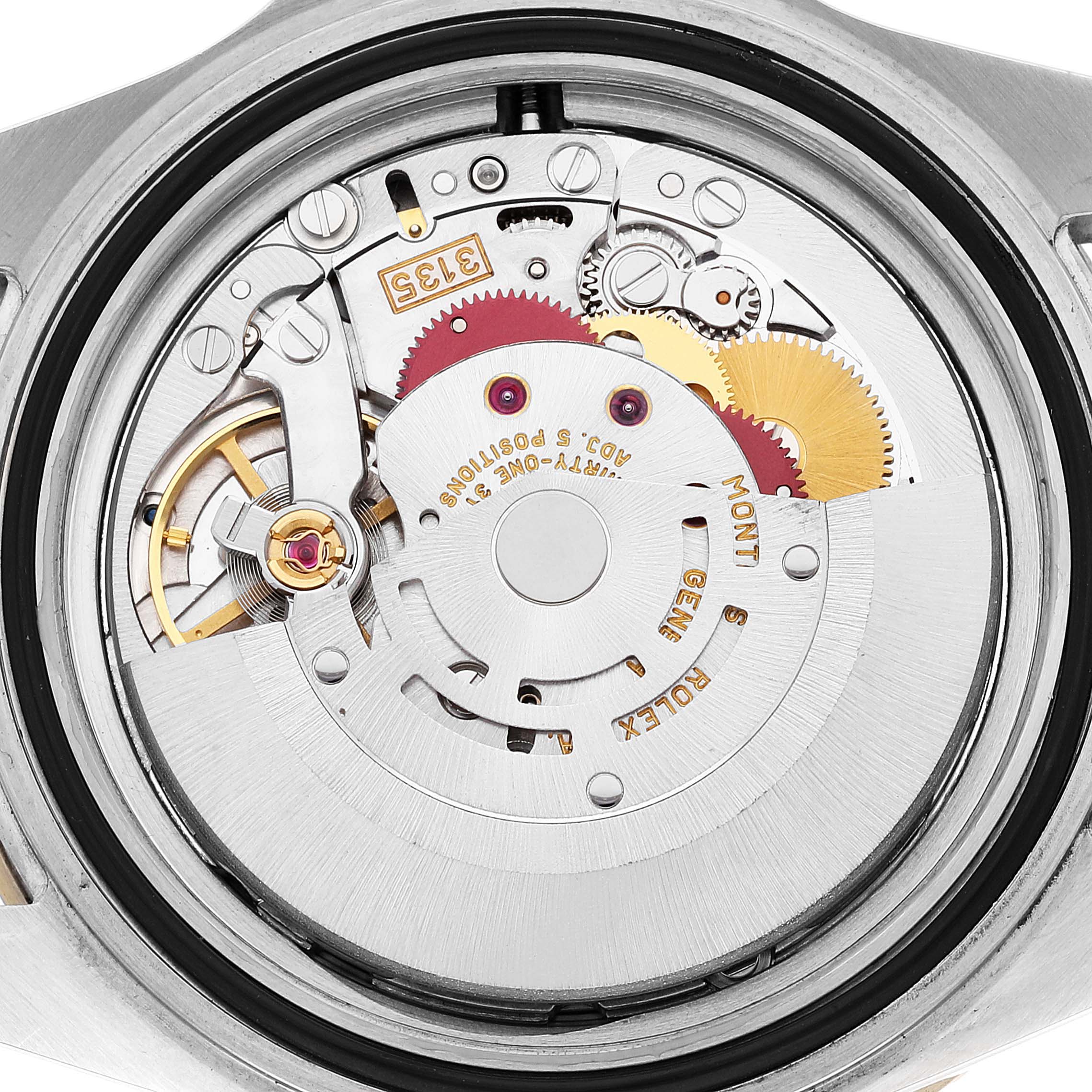 This image shows a close-up view of the internal mechanism of a Rolex Submariner 16613 Men's Steel and Gold (two tone) Blue Dial 16613 Men's Steel and Gold (two tone) Blue Dial watch.
