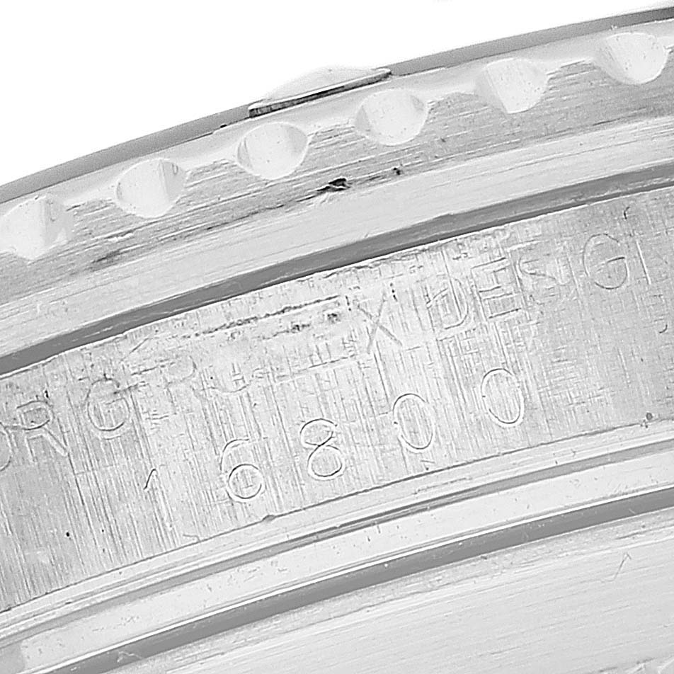 The close-up image shows the engraved serial number on the case side of the Rolex Vintage Collection 16800 Men's Stainless Steel Black Dial 16800 Men's Stainless Steel Black Dial model 16800.