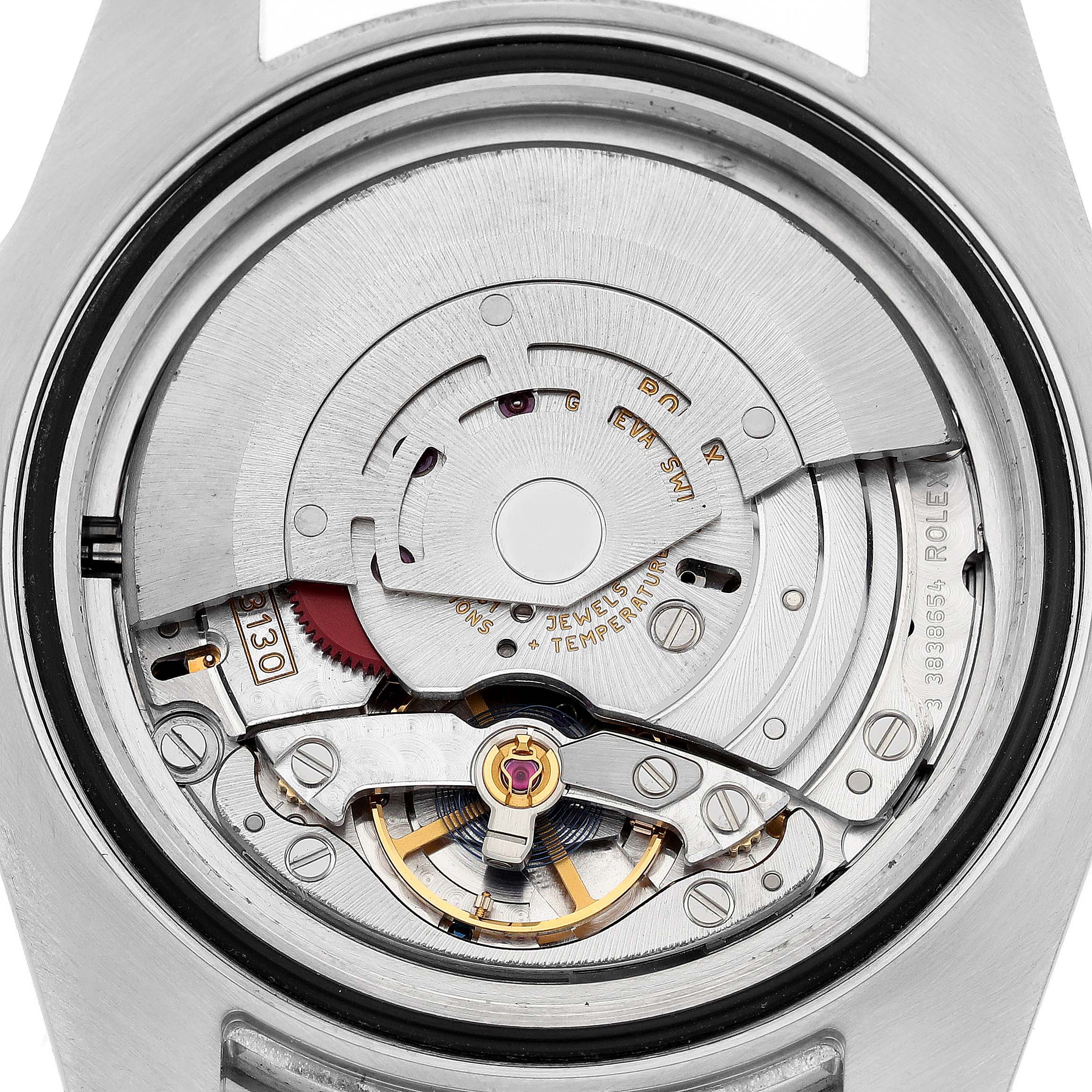 This image shows the internal movement of a Rolex Submariner 114060 Men's Stainless Steel Black Dial watch from the back, highlighting the rotor and balance wheel.