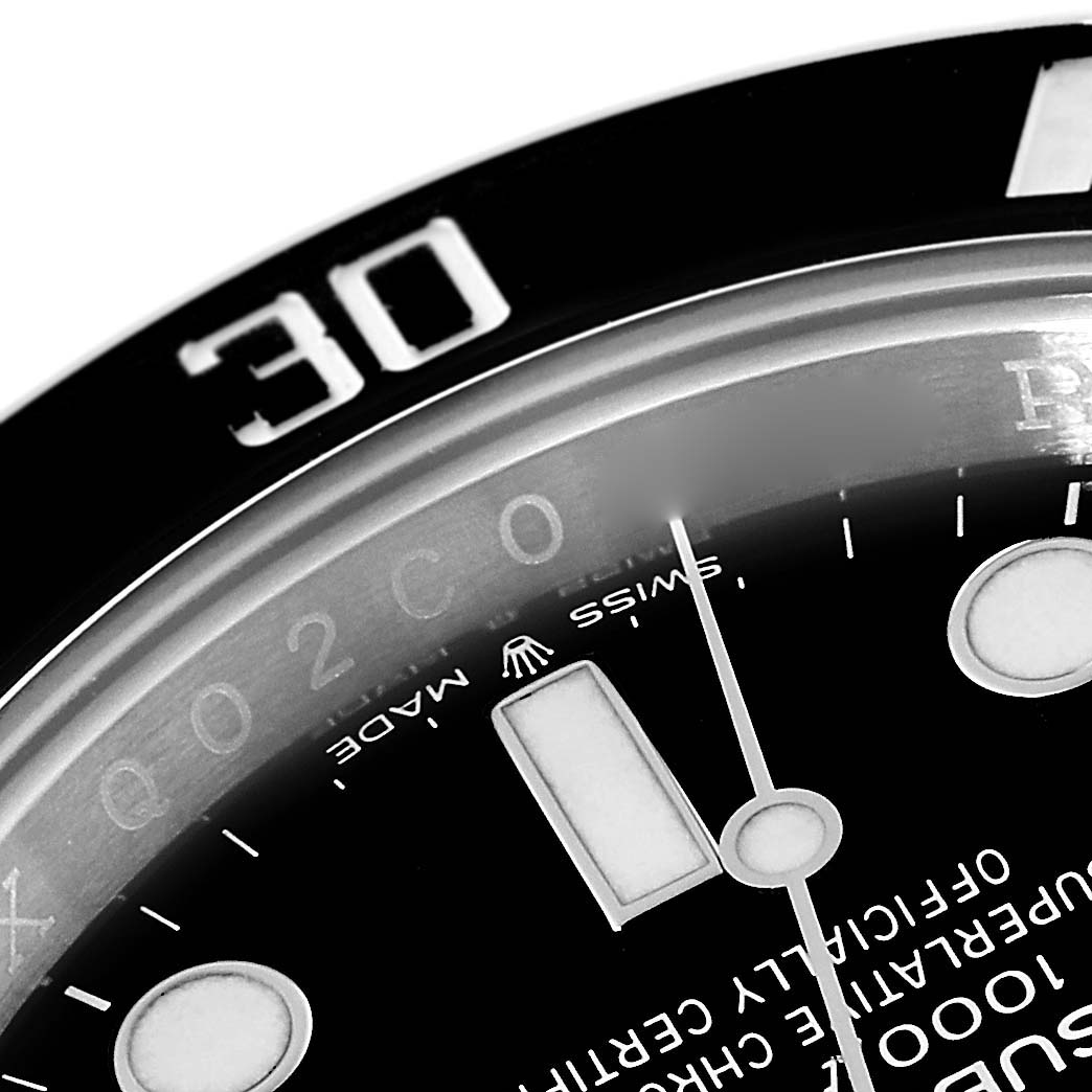 The image shows a close-up of the Rolex Submariner 124060 Men
s Stainless Steel Black Dial 124060 Men
s Stainless Steel Black Dial model watch
s dial and bezel, featuring the minute hand, markers, and "Swiss Made" text.