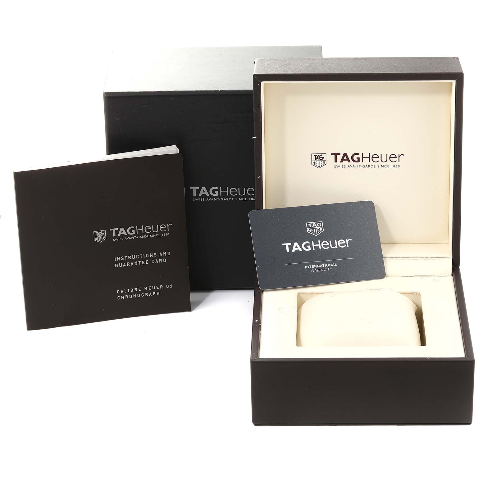 The image shows the packaging, instruction manual, and warranty card for a Tag Heuer Carrera CAR201V.BA0714 Men's Stainless Steel Black Dial CAR201V.BA0714 Men's Stainless Steel Black Dial watch.