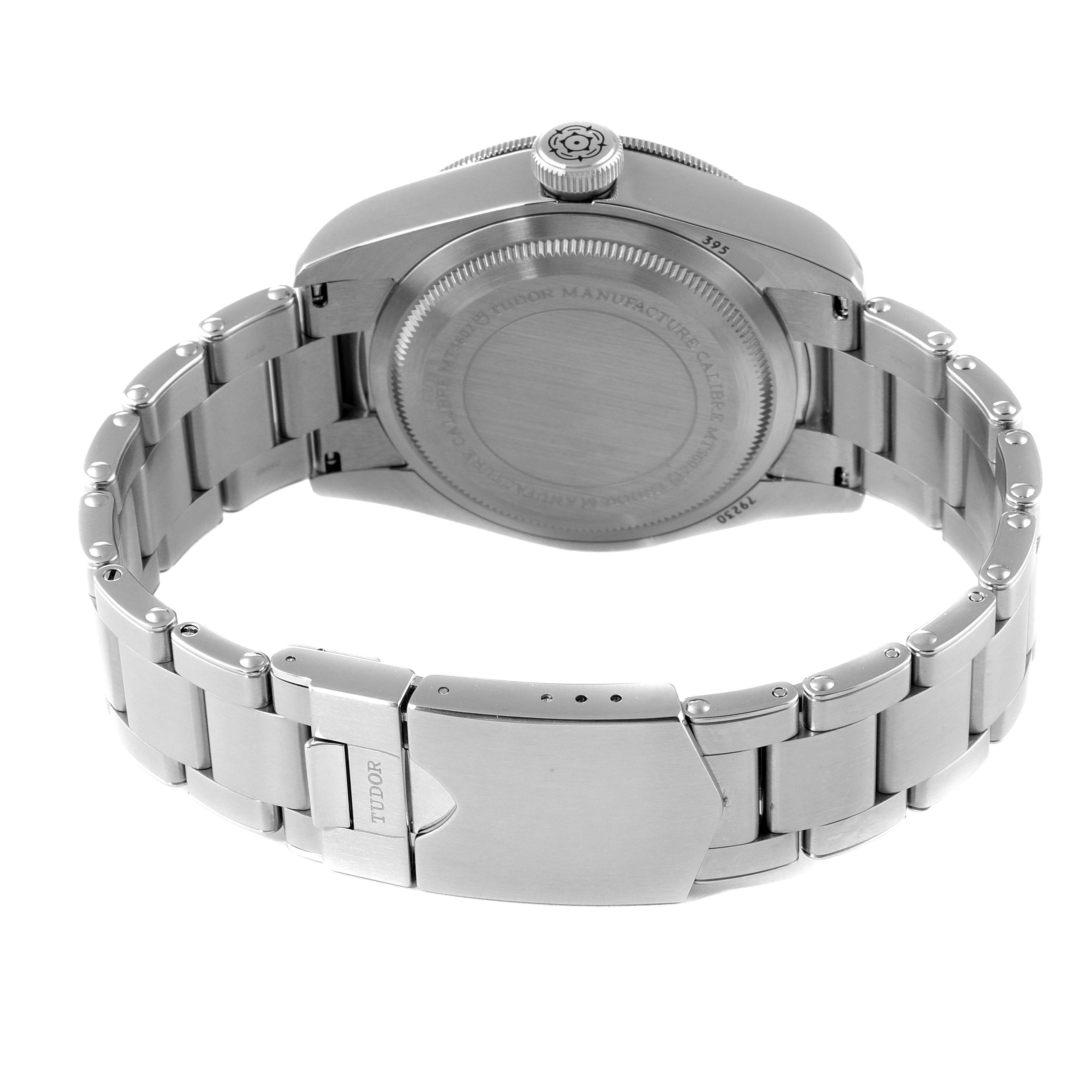 The image shows the back case and metal bracelet clasp of the Tudor Heritage Black Bay M79230R-0012 Men's Stainless Steel Black Dial M79230R-0012 Men's Stainless Steel Black Dial watch from a rear angle.