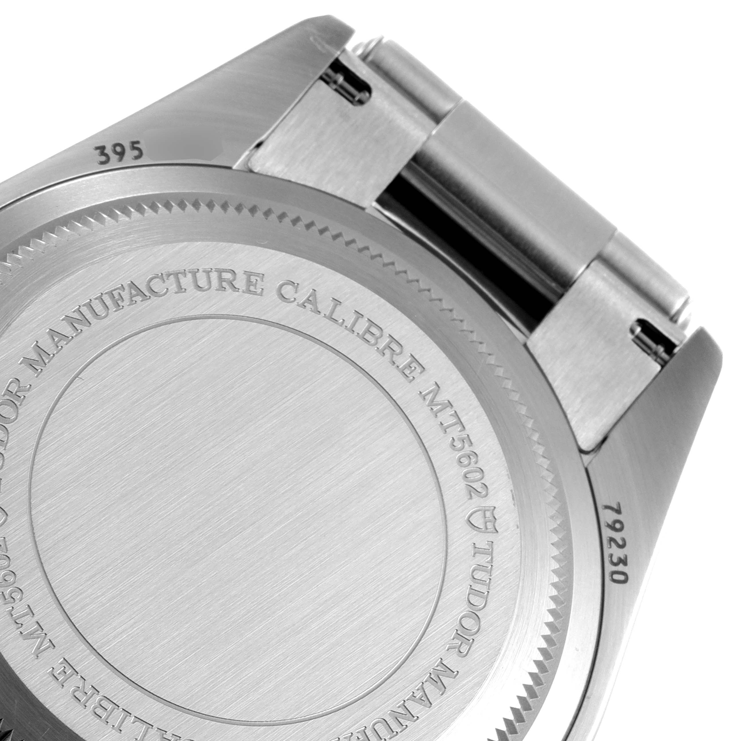 The image shows the back case and part of the bracelet of the Tudor Heritage Black Bay M79230R-0012 Men's Stainless Steel Black Dial M79230R-0012 Men's Stainless Steel Black Dial model watch.