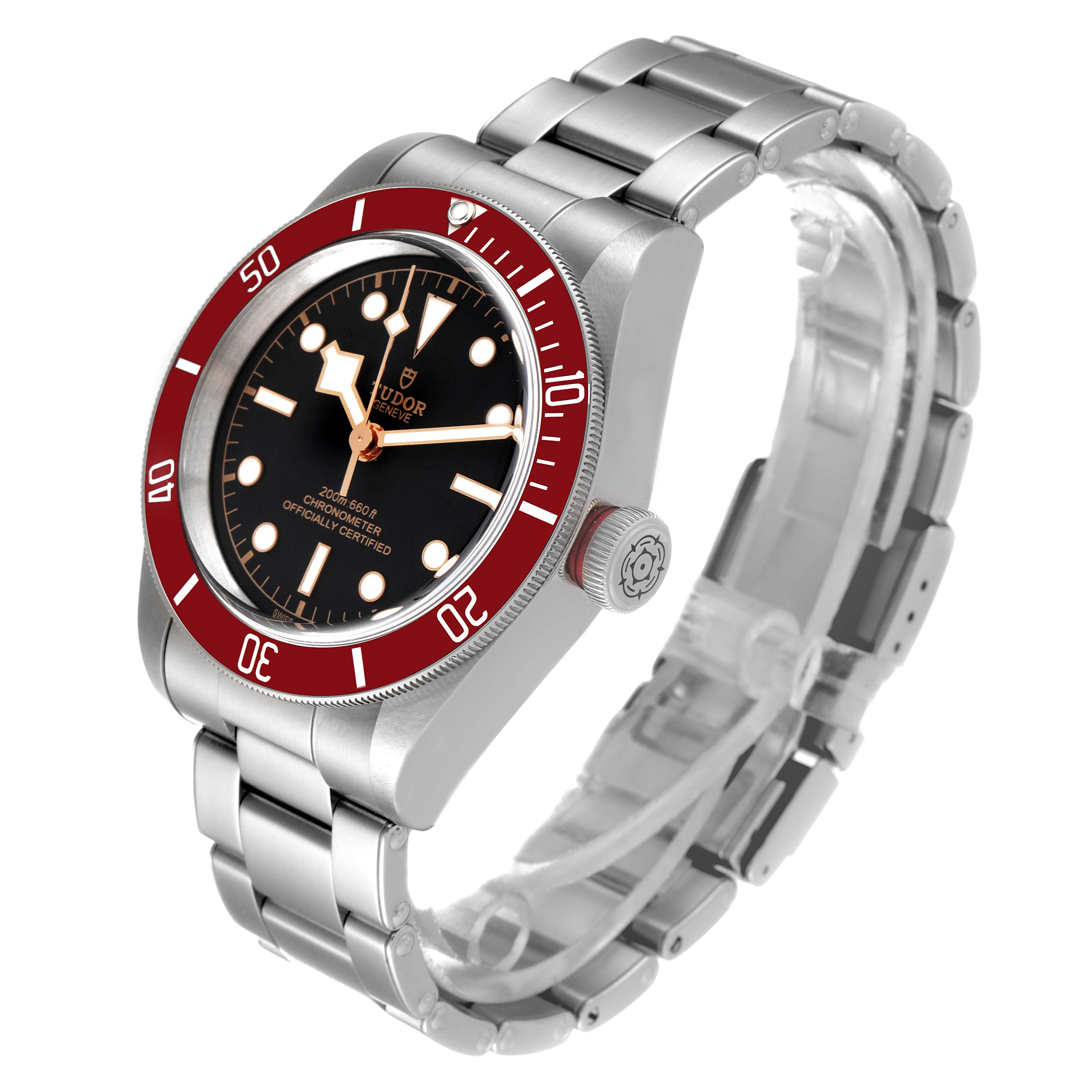 The Heritage Black Bay by Tudor is shown at a three-quarter angle, displaying its face, bezel, crown, and stainless steel bracelet.