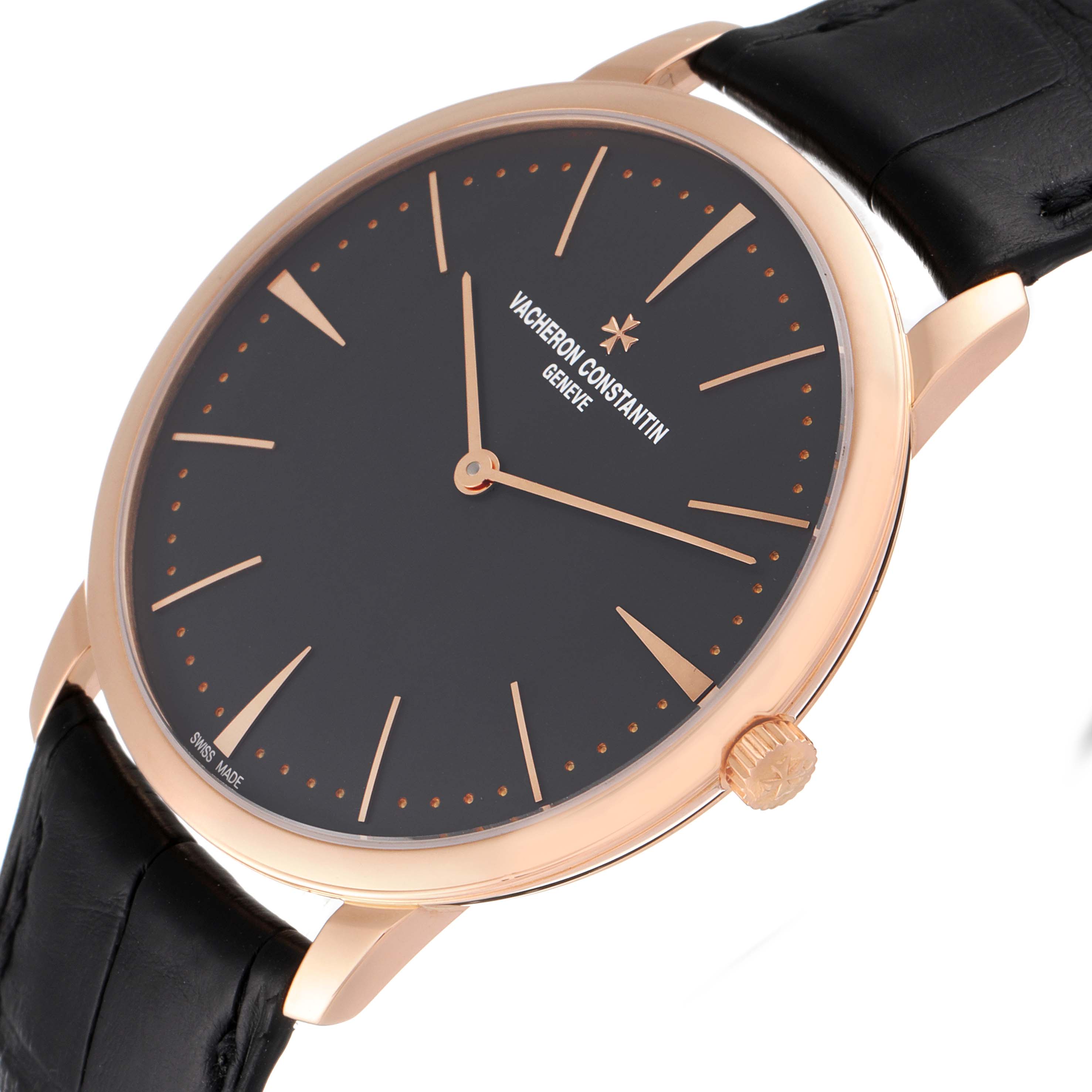 The image shows a close-up side angle of the Vacheron Constantin Patrimony 81180R/000R-9162 Men's Rose Gold Grey Dial 81180R/000R-9162 Men's Rose Gold Grey Dial watch, highlighting the black dial, rose gold case, and crown.