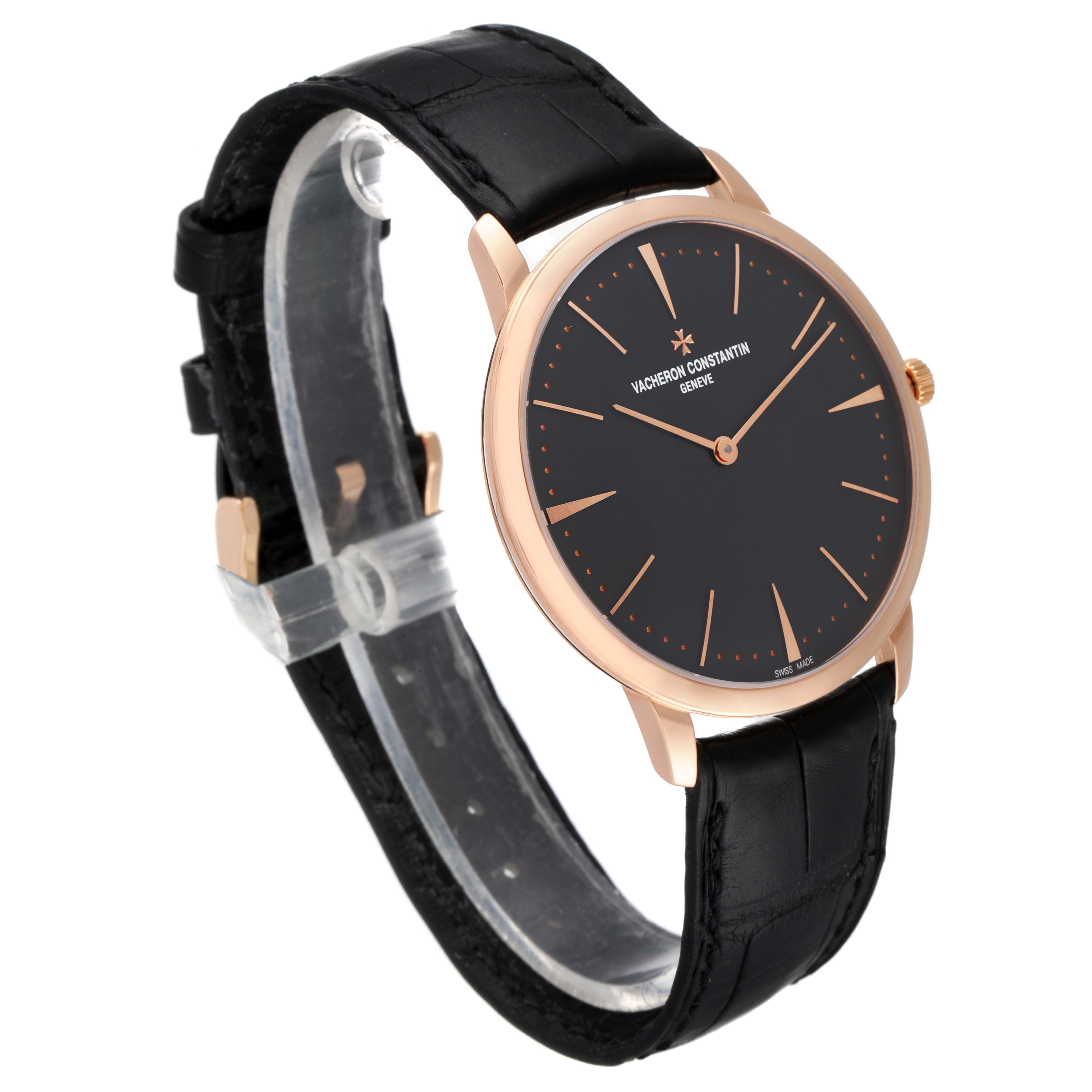This image shows a Vacheron Constantin Patrimony 81180R/000R-9162 Men's Rose Gold Grey Dial 81180R/000R-9162 Men's Rose Gold Grey Dial watch at an angled view, highlighting its black dial and leather strap.