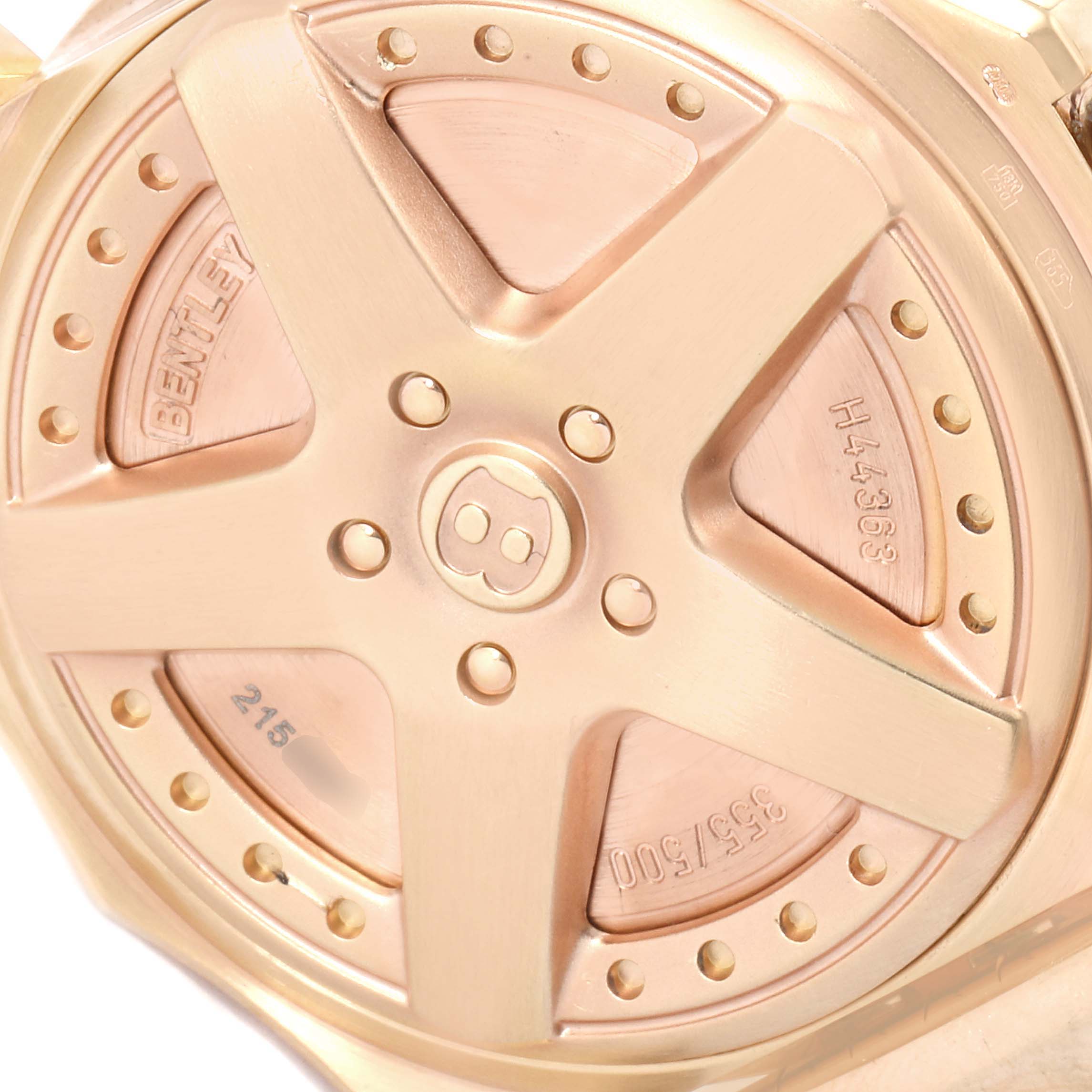 This close-up shows the back casing of a Breitling Bentley H44363 Men's Rose Gold Black Dial H44363 Men's Rose Gold Black Dial watch, featuring its distinct design and engraved details.