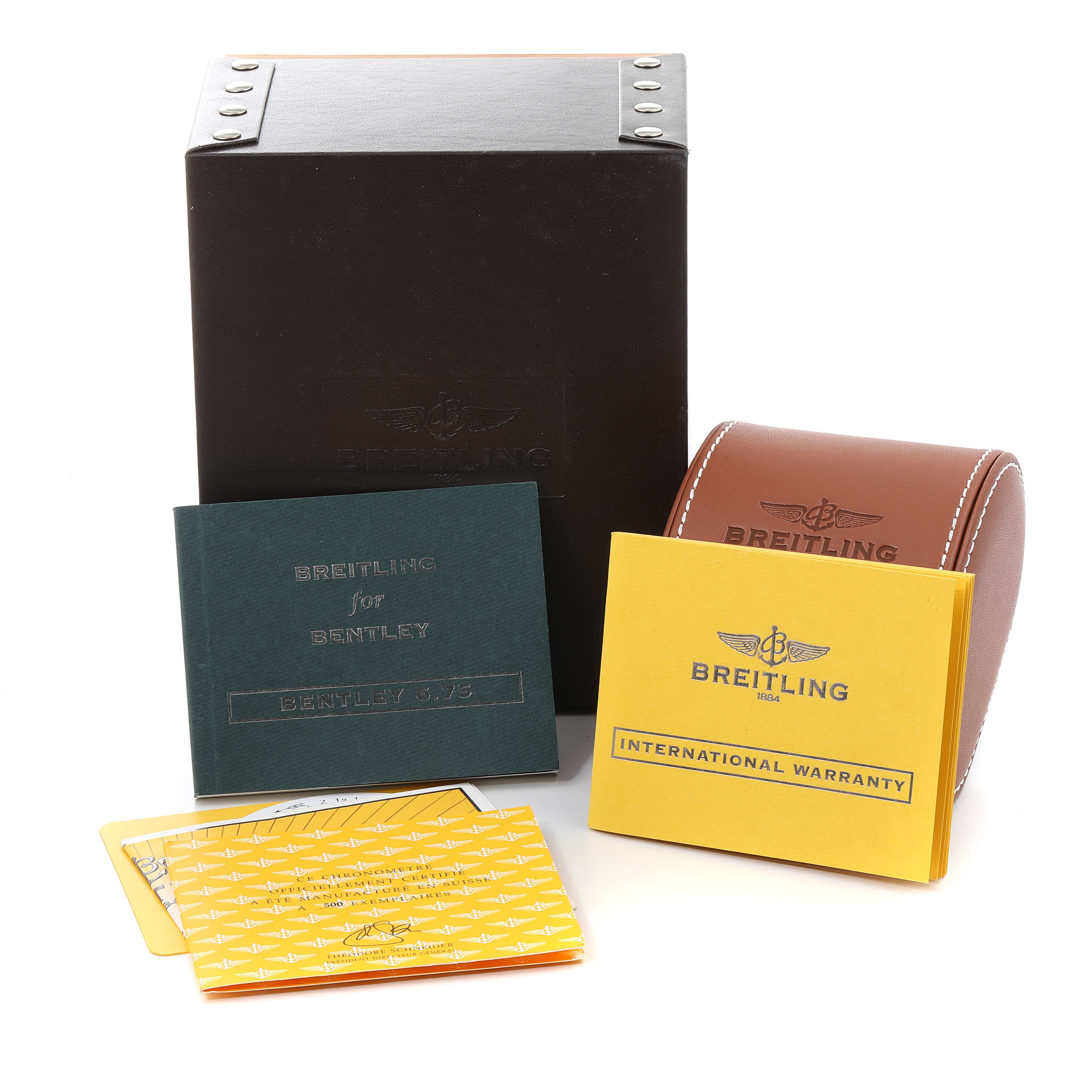 The image shows the packaging and accessories for a Bentley model watch by Breitling, including the box, warranty, and manuals.