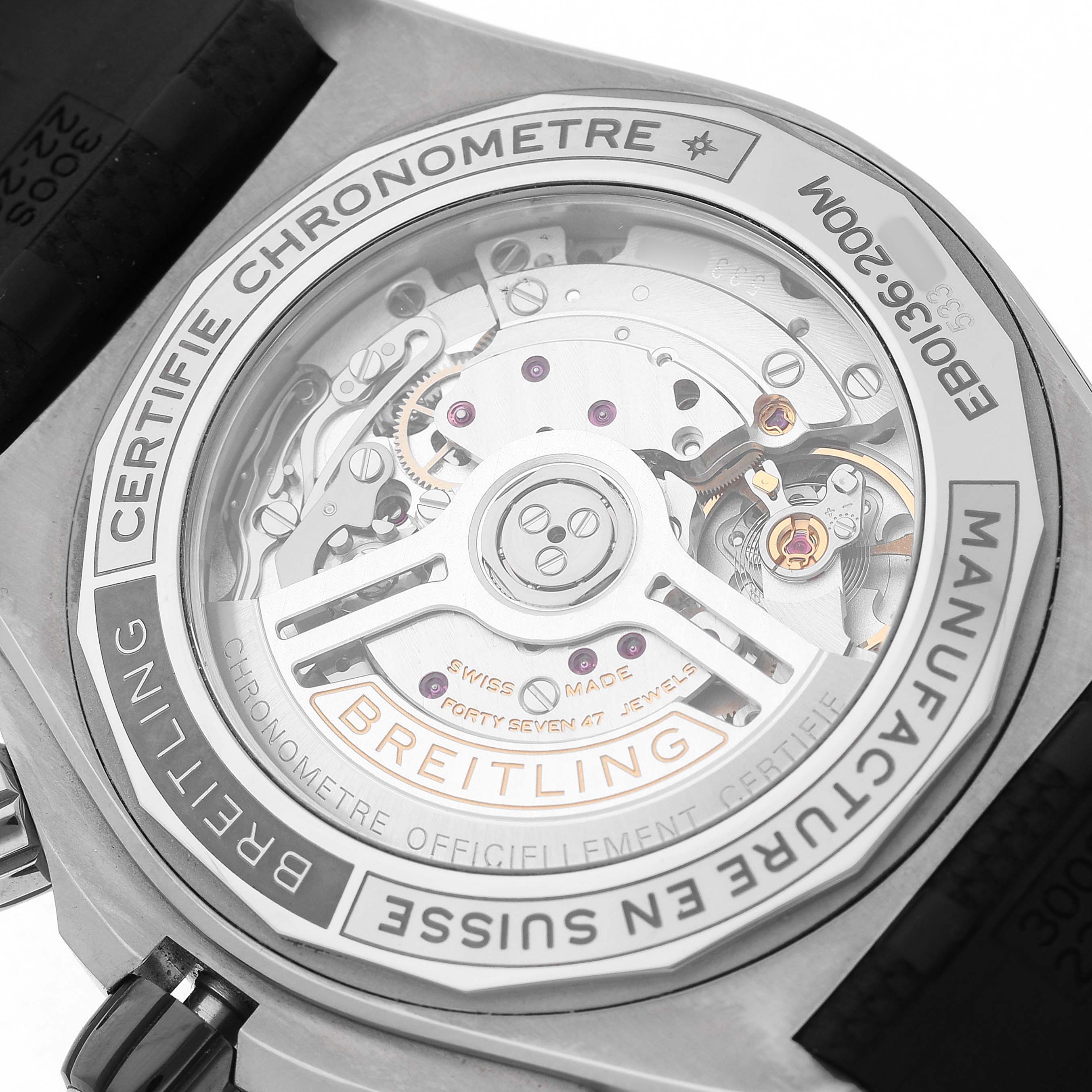 The image shows the back of a Breitling Chronomat EB0136 Men's Titanium Grey Dial, highlighting the movement through a transparent case back.