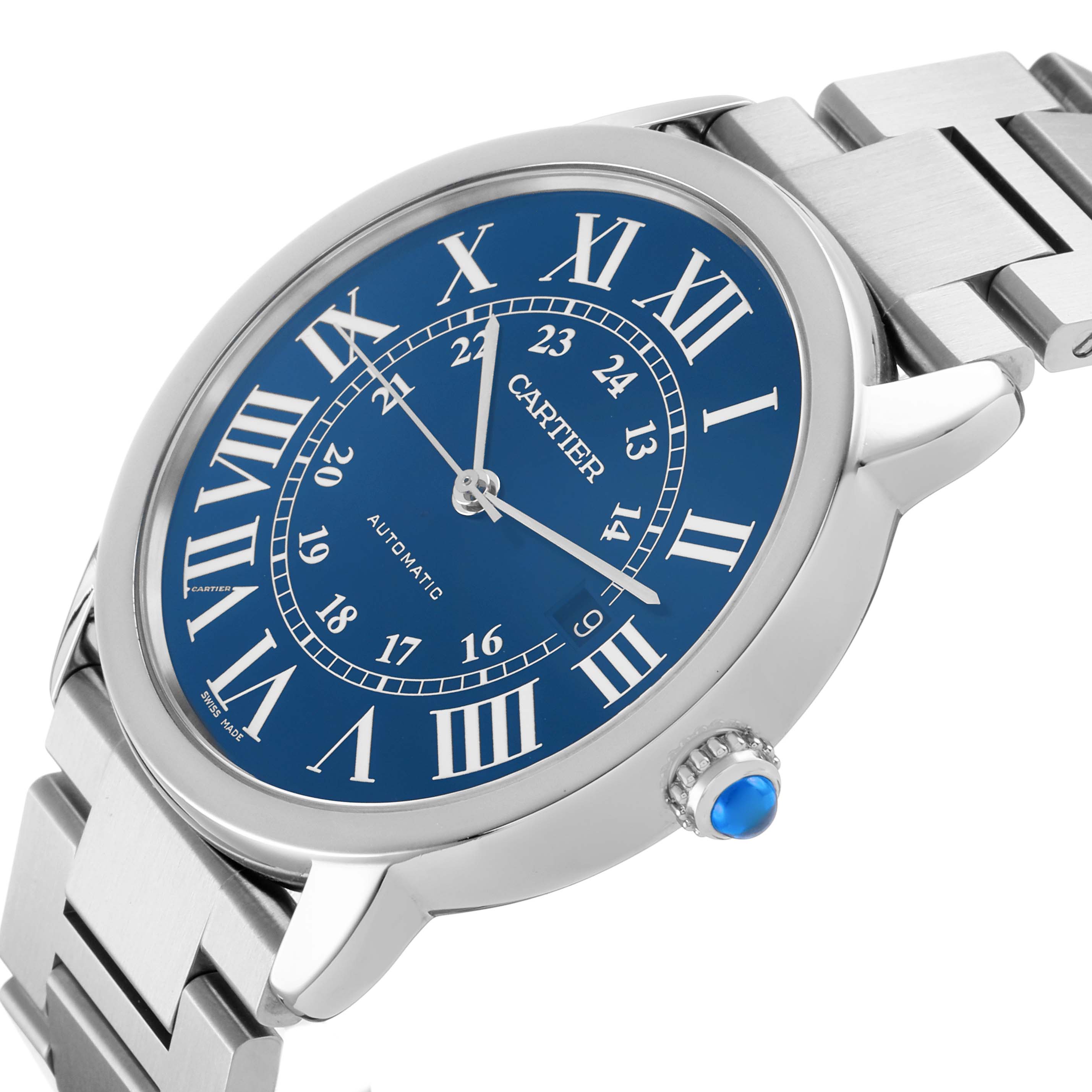 The Cartier Ronde WSRN0023 Men's Stainless Steel Blue Dial watch is pictured at an angled view, showing its blue dial, Roman numerals, and stainless steel bracelet.