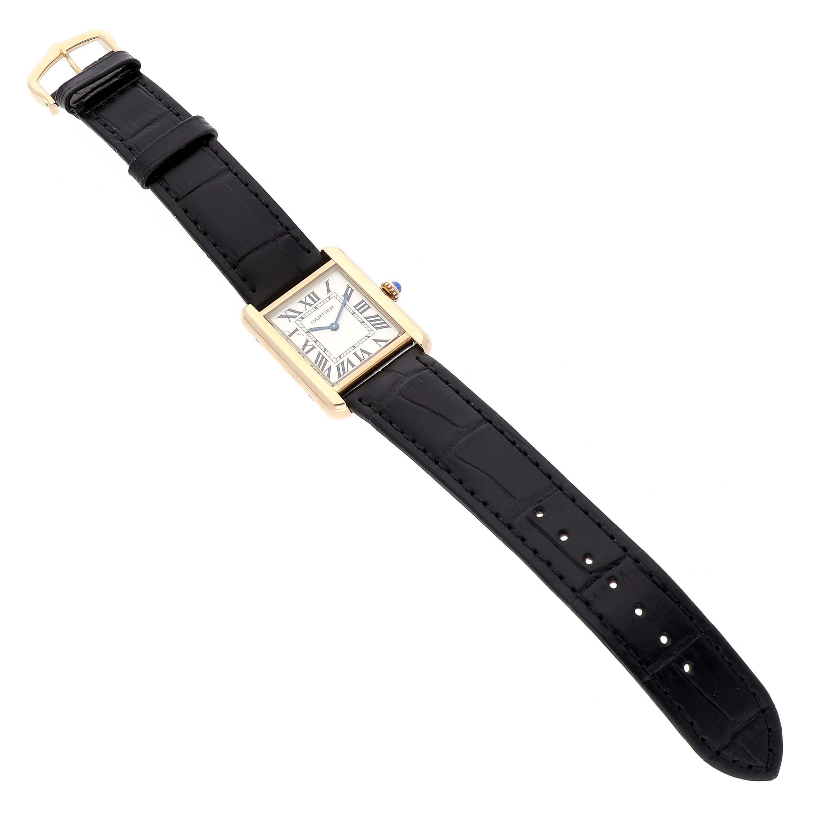 The Cartier Tank Solo W1018755 Women's Steel and Gold (two tone) Silver Dial watch is shown from a top-down angle, displaying its rectangular face, gold case, and black leather strap.