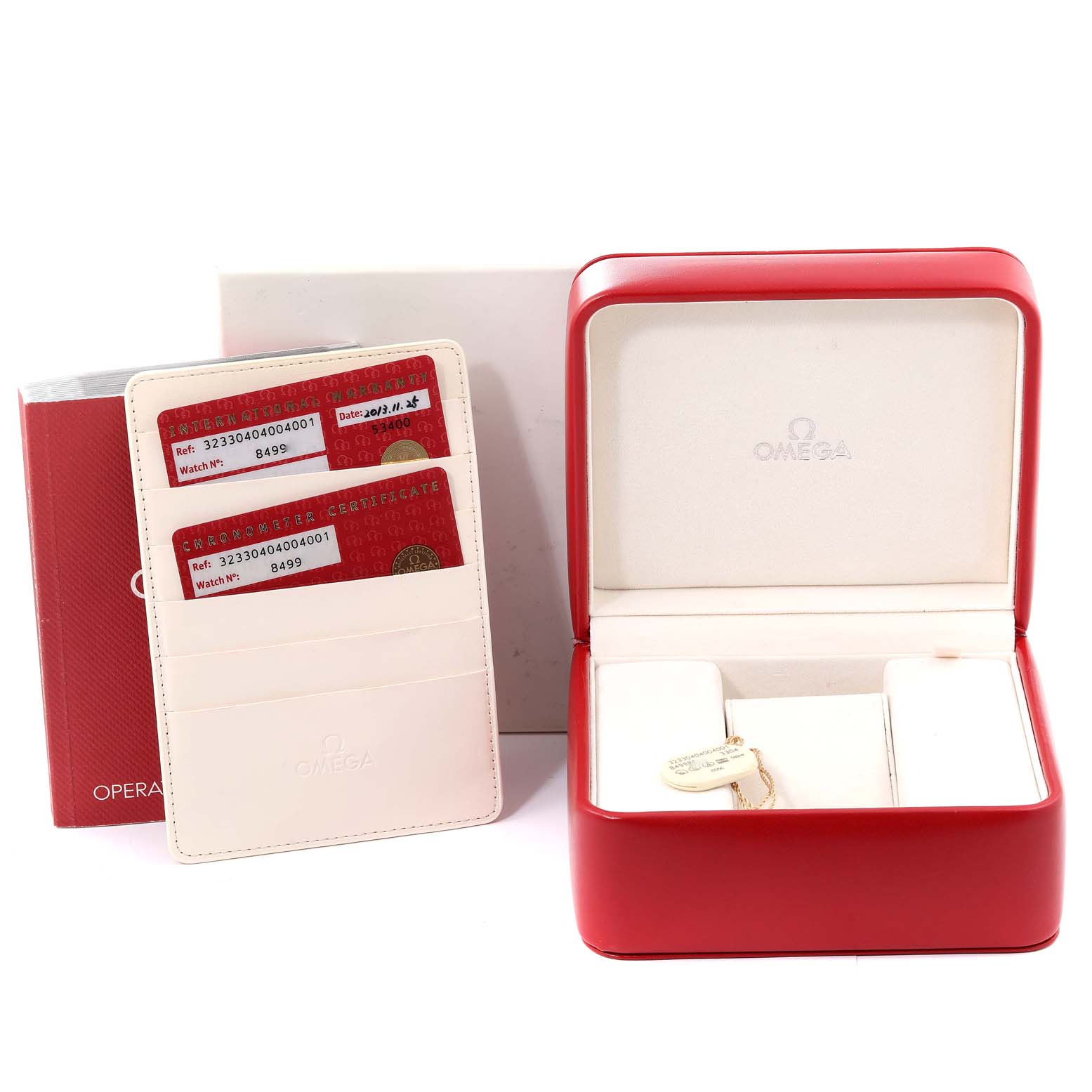 The image shows an Omega Speedmaster 323.30.40.40.04.001 Men's Stainless Steel White Dial 323.30.40.40.04.001 Men's Stainless Steel White Dial watch box, operating instructions, and certificate cards holder at a front angle.