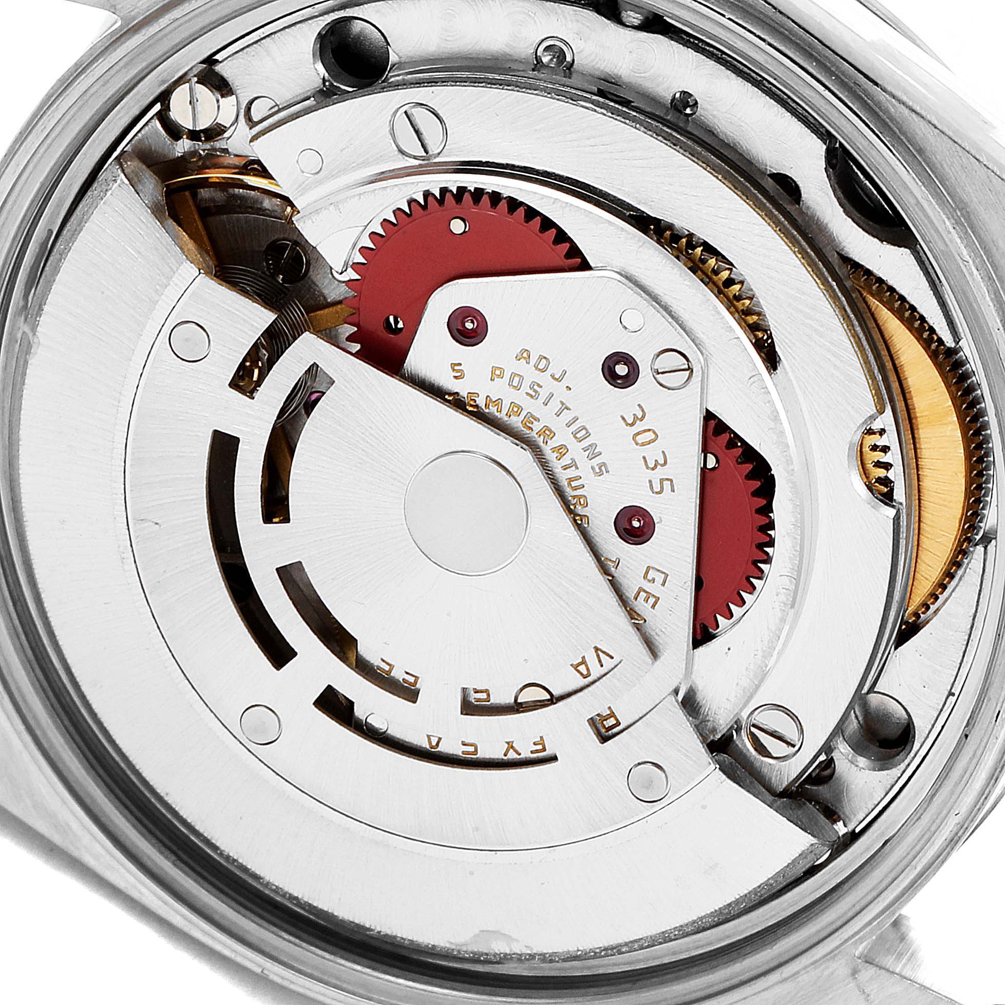 The image shows a close-up view of the inner mechanical movement of a Rolex Vintage Collection 15000 Men
s Stainless Steel Champagne Dial 15000 Men
s Stainless Steel Champagne Dial model watch.