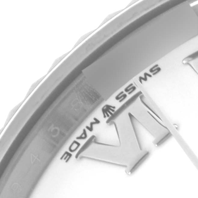 The image shows a close-up of the Rolex Mid-Size 278274 Women's Stainless Steel White Dial 278274 Women's Stainless Steel White Dial watch face, capturing part of the bezel and text detail.
